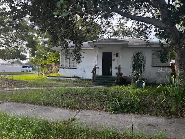 MOTIVATED SELLER - Unique Opportunity to restore older home with rental income, near downtown St. Pete. House sits on quiet corner lots with red, brick streets, mature trees and lots of charm. The main house consists of 3 Bedrooms and has versatility to be recreated. Adjacent to the house is a two story separate dwelling with a rental unit upstairs and one downstairs. The house needs a lot of work, however the homesite has great possibilities