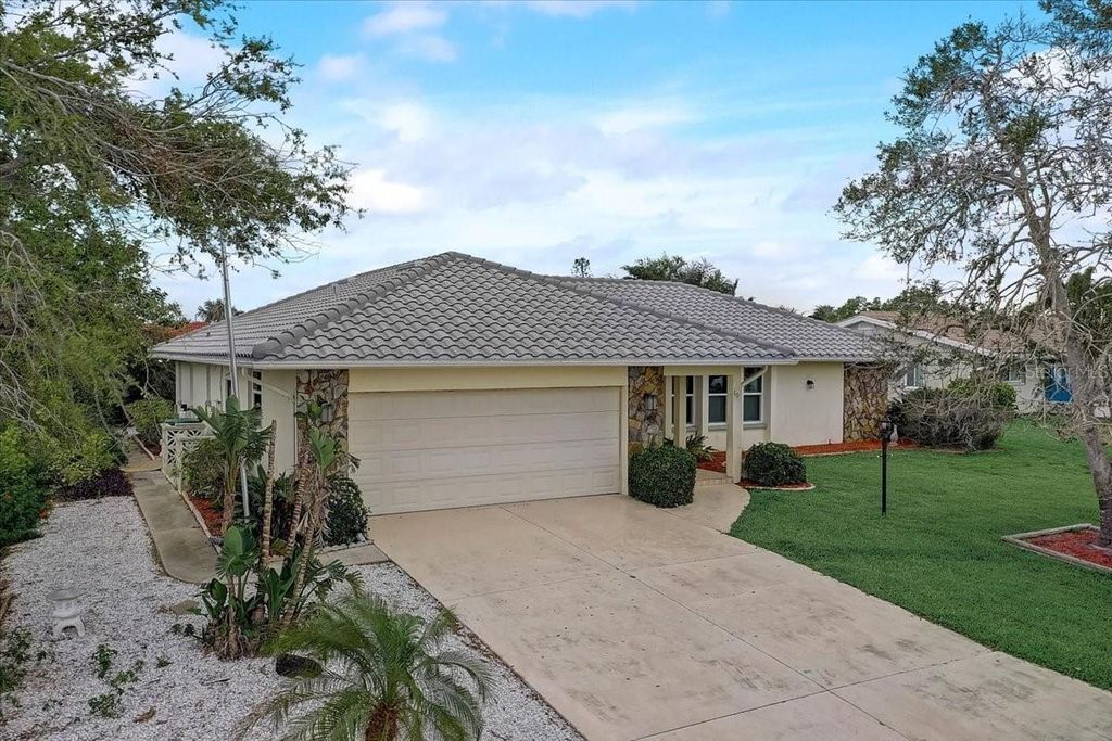 Photo of 10 Stone Mountain Boulevard, Englewood, FL 34223 (MLS # A4656653)