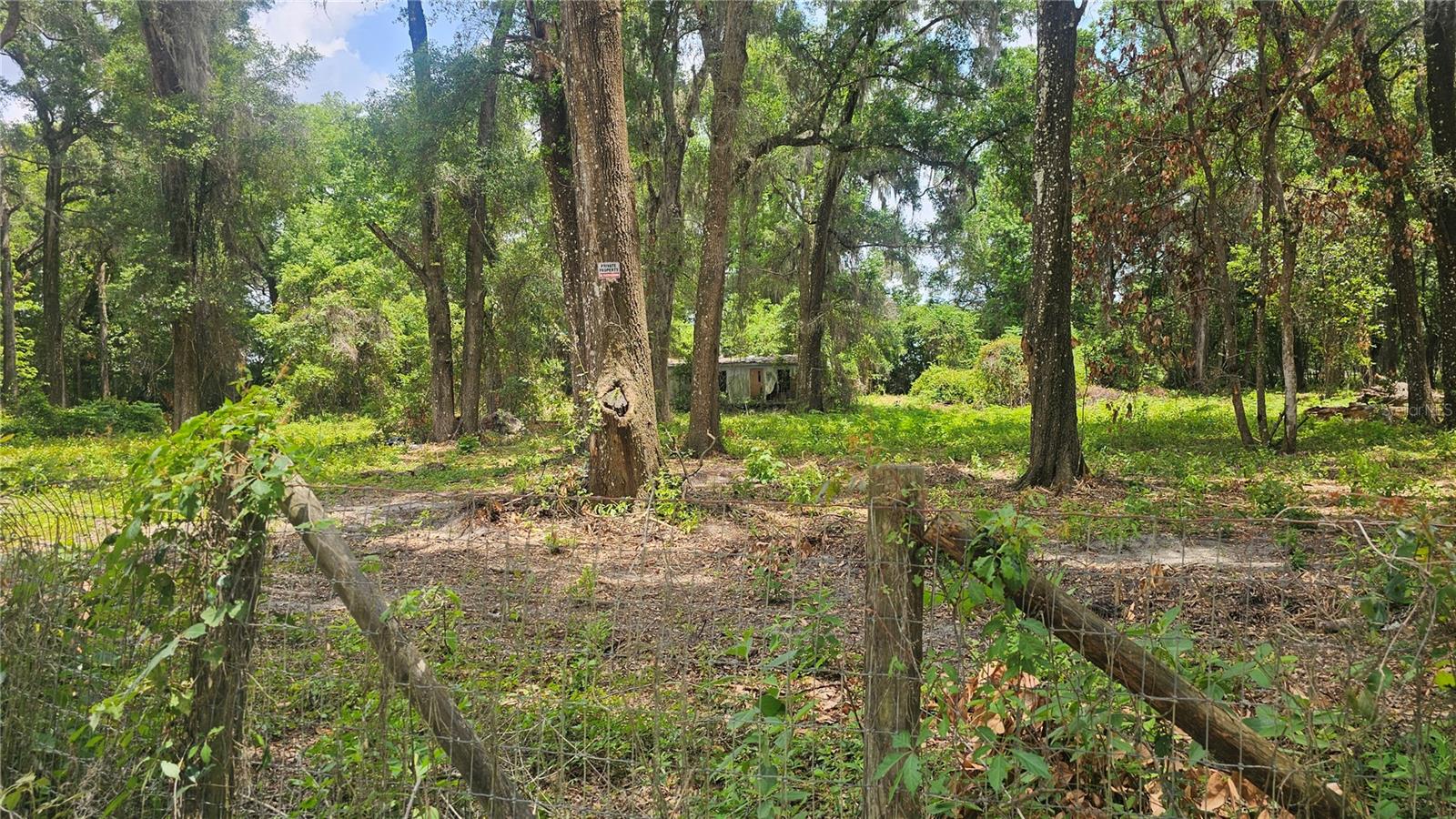 Opportunity Awaits in Summerfield – 4.1+ Fully Fenced & Cleared Acres with R4 Zoning!
Discover the endless possibilities at 17693 SE 30th Ave, Summerfield, FL — over 4.1 fully fenced, cleared acres in a prime location, zoned R4 for flexible use. Whether you’re seeking space for your own homestead, looking to develop, or planning a buy-and-hold investment, this property offers a rare combination of space, location, and potential. With existing well, power, and septic connections already in place, you have a head start on your vision. The property can be subdivided into multiple lots, giving you the option to build, sell, or rent part of the land while keeping the rest for yourself. Imagine creating your own residence on one portion while generating income from the other — the possibilities are yours to shape. A 3-bedroom, 2-bath mobile home currently sits on the property. It is uninhabitable and being sold as is, making this the perfect blank slate for your plans. Bring your creativity and take advantage of this rare land opportunity. Opportunities with this much flexibility don’t come around often!