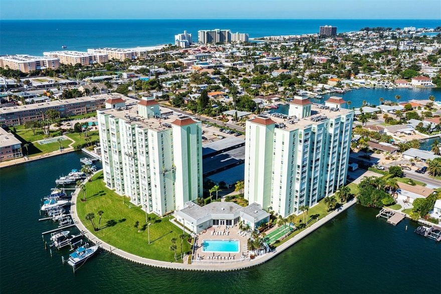 Available February 1st! 6 month minimum rental. No pets allowed. Live steps from the lush white sands of St Pete Beach! Enjoy the morning sunrise AND stunning sunsets from your west facing 10th floor condo. Water views from every window and from your Gulf view balcony. Sought after split floor plan with lots of privacy and water views. The kitchen layout is perfect for cooking or entertaining and offers plenty of counter and cabinet space with updated all wood cabinets and solid stone surface countertops. More bonus features include a premium assigned parking spot (#234) along with free washers/dryers private to each floor and a private storage cage at the end of the hall. Community amenities: 24-hour Guard & Security, waterfront heated swimming pool, Clubhouse, card room, library, Billiards room, fitness center with sauna. Also enjoy the private fishing pier, shuffleboard, kayak, bike & storage lockers (extra fee). Lots of social activities planned and all ages are welcome! This convenient location is a walk-able 3-blocks from the beach, upscale restaurants, local shopping, major highways or a quick ride to Tampa International Airport.