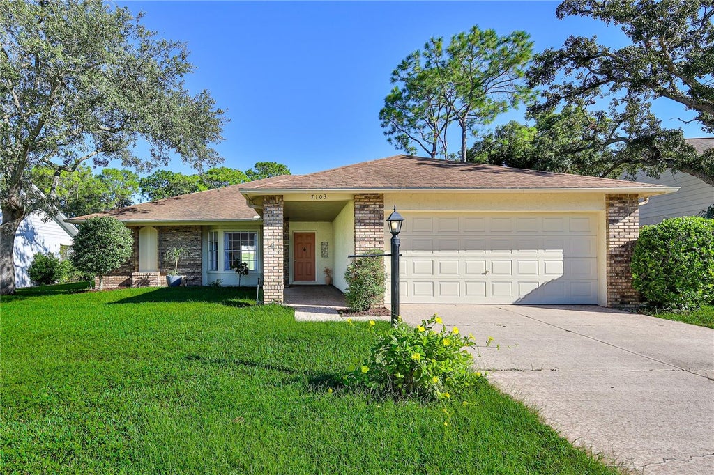 Photo of 7103 Crown Oaks Drive, Spring Hill, FL 34606 (MLS # W7890150)