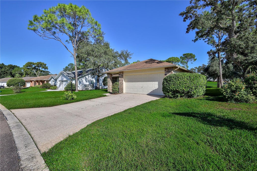 Photo of 7103 Crown Oaks Drive, Spring Hill, FL 34606 (MLS # W7890150)