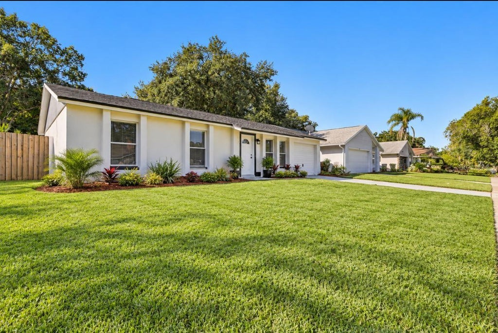 Photo of 3610 Falling Leaf Lane, Orlando, FL 32810 (MLS # O6449463)
