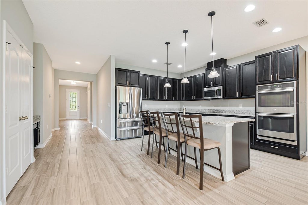 Photo of 5201 Appenine Loop E, Saint Cloud, FL 34771 (MLS # O6447644)