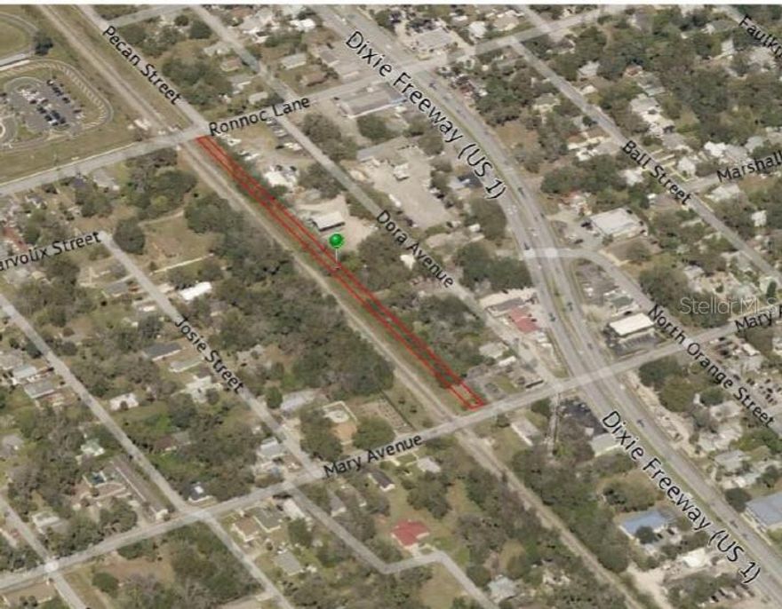 Long, narrow parcel of land just east of the railroad tracks. Parcel Runs from Ronnoc Lane south to Mary Avenue.