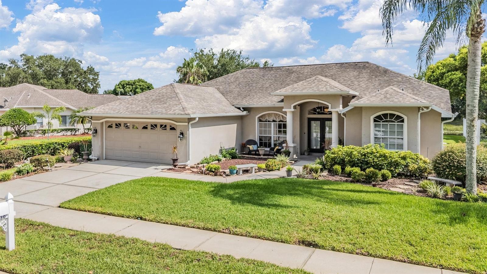 Beautifully Maintained Pool Home with Pond View. Welcome to this beautifully maintained 3-bedroom, 2.5-bath home offering the perfect blend of comfort, style, and functionality. Located on a serene pond, this home features a split floorplan that provides extra privacy. Enjoy direct access to the pool from the formal living room, kitchen, family room, and primary suite; ideal for entertaining or quiet relaxation. The formal dining room is perfect for hosting, while the family room features rich hardwood floors, adding warmth and elegance. The renovated kitchen boasts solid wood cabinetry and an eat in kitchen layout. Additional features include: New AC (July 2025), three new hurricane-impact windows added to rear of the home (July 2025), lanai pavers freshly sealed (July 2025), aluminum pool cage newly painted and rescreened (July 2025). This home checks all the boxes for Florida living with its blend of thoughtful upgrades, a well-designed layout, and beautiful outdoor space. Don’t miss the opportunity to make it yours!