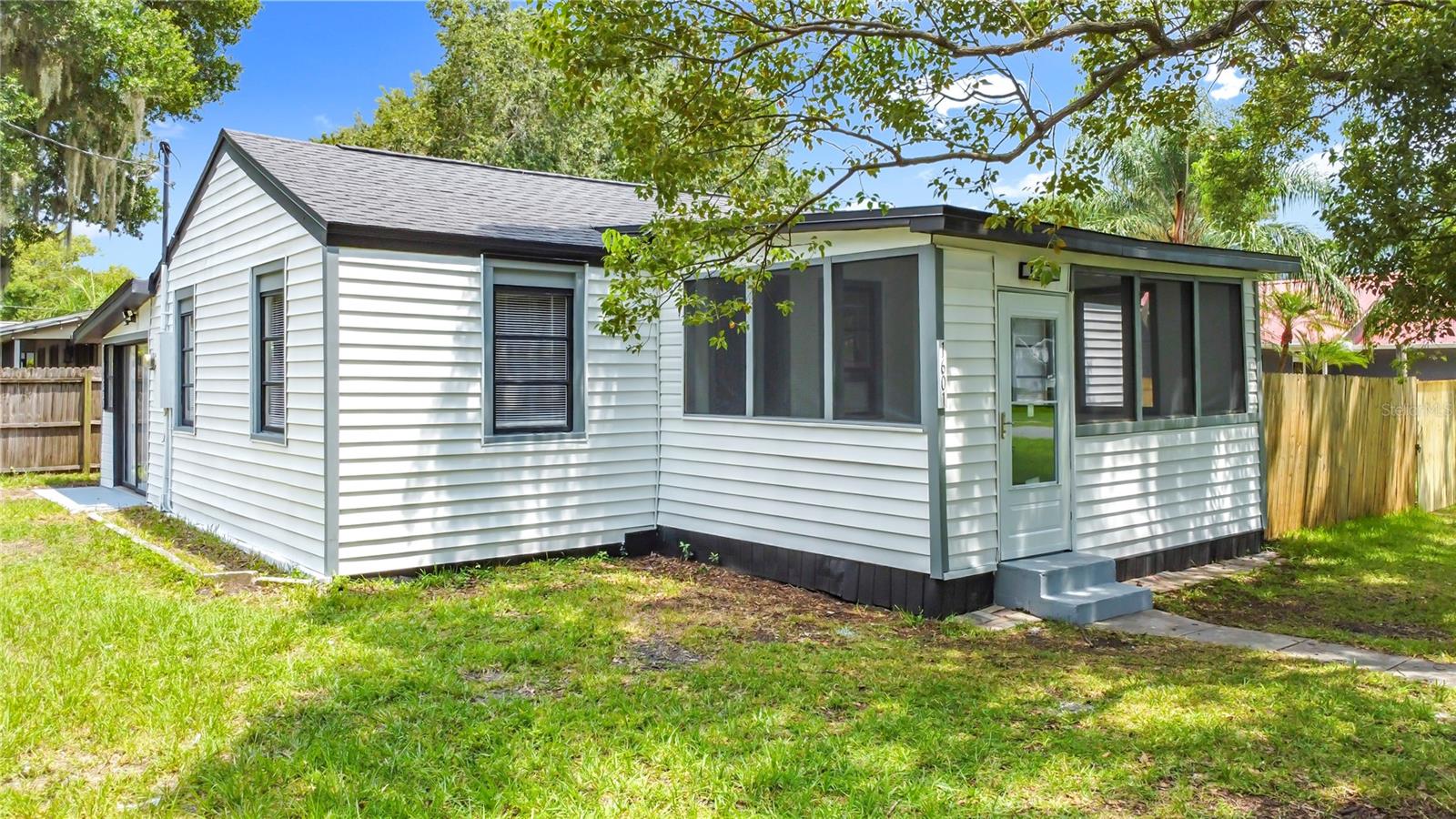Welcome to 1601 New York Ave, Saint Cloud, FL — a beautifully renovated home on a spacious corner lot offering flexibility, charm, and modern upgrades in one of Central Florida’s fastest-growing communities.
This move-in-ready property features new vinyl plank flooring throughout, an open and inviting layout, and a fully updated kitchen with new soft-close cabinets, countertops, and a stylish backsplash, perfect for entertaining or everyday living.
Both bathrooms have been completely renovated, showcasing sleek fixtures and contemporary design. Major system updates include updated electrical and plumbing, along with a 2018 AC unit and 2020 roof, ensuring long-term comfort and peace of mind.
A standout feature is the large rear addition, offering endless versatility—it can easily serve as a third bedroom, home office, or expansive master suite, tailored to your needs.
Situated on a fully fenced-in corner lot, there’s plenty of room for outdoor living, pets, or future projects. Located just minutes from downtown Saint Cloud, schools, shopping, and the lakefront, 1601 New York Ave combines style, functionality, and location into one exceptional offering.
Don’t miss your chance to tour this upgraded home—schedule your private showing today!