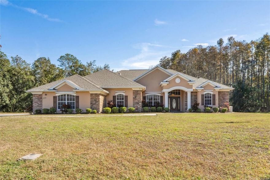 Proudly offered is this ONE-OWNER, WELL MAINTAINED CUSTOM-BUILT HOME set on 1.82 private acres perfect for those seeking space, privacy and timeless craftsmanship. This 4 bedroom, 3 bathroom residence showcases beautiful custom woodwork throughout, coffered ceilings, and a convenient central vacuum system.  The VERY LARGE PRIMARY SUITE is a true retreat, featuring TWO WALK-IN CLOSETS and generous space to unwind. The family room and kitchen truly serve the heart of the home, boasting stunning details including a GAS FIREPLACE, built-in shelving, custom woodwork and coffered ceilings----ideal for everyday living and entertaining. Car enthusiasts and outdoor lovers will appreciate the 895 sq. ft. garage, plus exceptional storage options including a 24x25 COVERED ALUMINUM STORAGE AREA WITH POWER for your boat or toys, and an additional 15x15 ENCLOSED SHED. Enjoy peace of mind with a BRAND NEW ROOF (11/2025) and the pride of ownership evident throughout this exceptional property. If you need space, quality construction, and privacy, this home is a must-see! Don't delay----schedule your showing today!