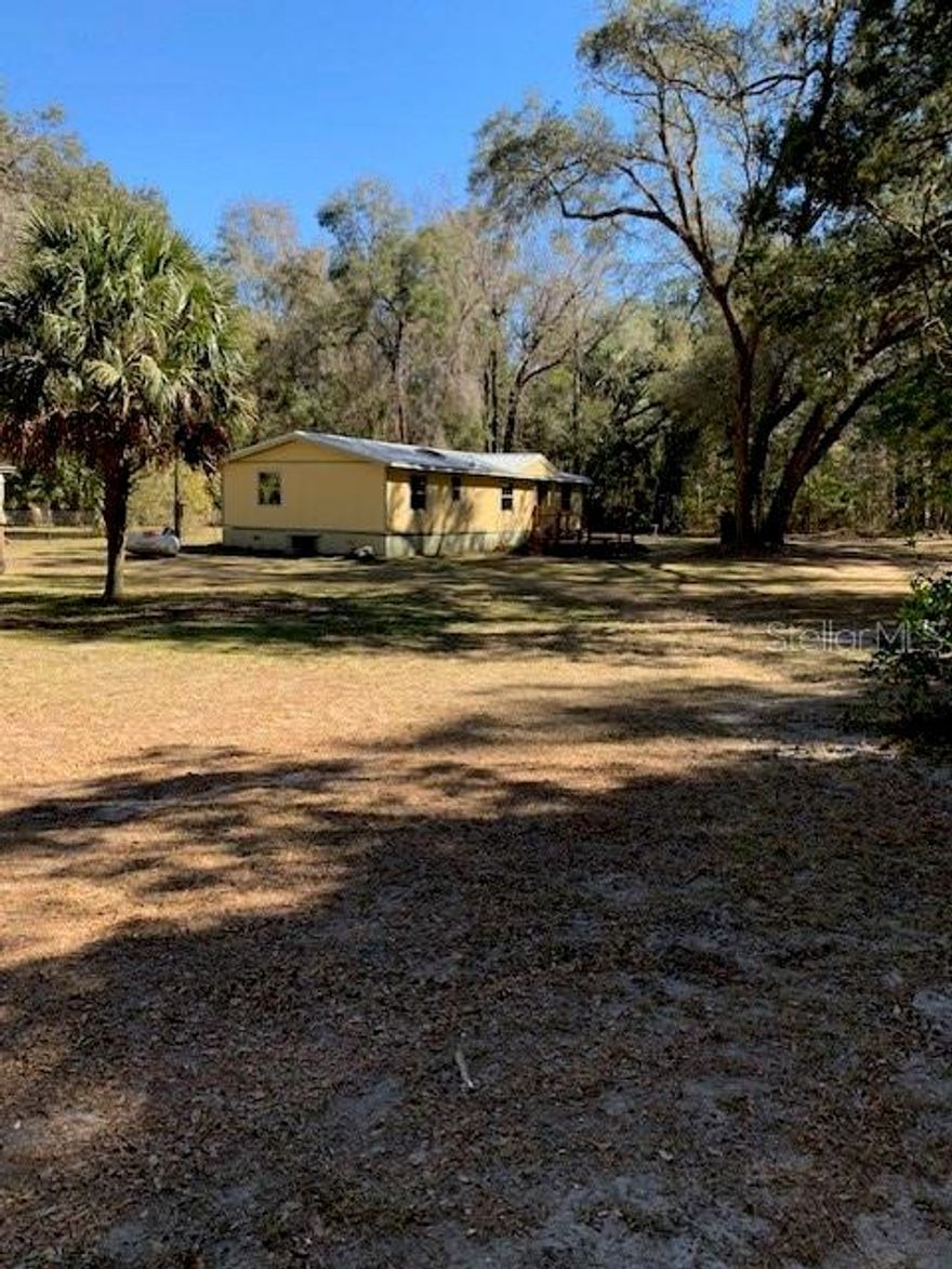 If you’re seeking privacy without sacrificing convenience, this exceptional property offers the best of both worlds. Tucked away in a charming, close-knit community where neighbors look out for one another, you’ll enjoy peaceful country living just 10 miles from Gainesville and Williston.
This nature lover’s paradise spans 10 pristine acres of classic Old Florida landscape, measuring approximately 492' x 886'. The existing home sits roughly 500 feet off the road, providing added privacy and tranquility.
The home has been professionally releveled, and the interior has been taken down to the studs—offering a blank canvas for your vision. The property has also undergone extensive cleanup and is ready for you to complete the remodel or build your dream home from the ground up.
Improvements already in place include:
Electricity with RV outlet
Well with water softener
Septic system
120-gallon propane tank (serving the water heater, furnace, and stove)
The price reflects the remaining repairs and interior completion, making this a fantastic opportunity to customize the home to your exact style and needs.
Don’t miss your chance to own a private, peaceful slice of Old Florida—ready for your finishing touch.