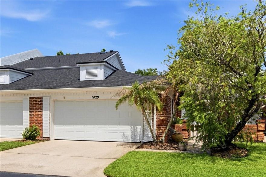 Welcome to the highly sought-after Country Club Villas of Rio Pinar, an exclusive 14-unit community offering a rare opportunity to own a spacious one-story condominium in one of Orlando’s most desirable locations. Surrounded by mature landscaping and timeless brick exteriors, this beautifully maintained villa combines comfort, privacy, and low-maintenance living with the feel of a single-family home. Step through the private entrance courtyard and into an expansive 1,732-square-foot layout designed for both everyday living and entertaining. Soaring ceilings, recessed lighting, upgraded ceiling fans, and a cozy wood-burning fireplace create a warm and inviting atmosphere, while luxury vinyl plank flooring throughout the main living areas adds both elegance and durability. Upgraded solid rear sliding glass doors enhance the home’s natural light and seamlessly connect the indoor living spaces to the outdoors. The beautifully updated kitchen is thoughtfully designed with upgraded solid wood 42-inch soft-close cabinetry, granite countertops, newer GE appliances, and abundant storage and prep space. A charming breakfast nook highlighted by a bay window fills the area with natural light, creating the perfect place to start your day. The spacious family room and primary suite both open to a large screened and enclosed patio featuring breathtaking 180-degree wooded conservation views, offering a peaceful setting to relax and enjoy Florida living year-round. Rain gutters and thoughtful exterior upgrades add additional convenience and value. The spacious primary retreat offers comfort and privacy with direct patio access, a beautifully upgraded dual-sink vanity, and a walk-in shower in the master bath. A split-bedroom floor plan places the guest bedroom and full bath away from the owner’s suite, while the versatile flex room is ideal for a home office, den, library, or formal dining room. The guest bedroom also features a charming window bench seat that adds both character and functionality. Additional highlights include an indoor laundry room complete with front-load washer and dryer, attached two-car garage, pull-down attic stairs for additional storage, garage door replaced in 2018, LiftMaster garage door opener installed in 2022, HVAC replaced in 2022, and re-roof with gutters in 2023 for added peace of mind. Residents enjoy a truly carefree lifestyle with the association covering landscaping, exterior maintenance, roof care, and building insurance. Perfectly positioned near the renowned Rio Pinar Country Club, residents can enjoy golf, dining, and social activities just moments away. The location also provides quick access to medical facilities, Waterford Lakes Town Center, Valencia College, UCF, Orlando International Airport, world-famous attractions, and major highways including SR 417 and SR 408 for easy commuting throughout Central Florida. Whether you are searching for a primary residence, seasonal retreat, or low-maintenance lifestyle in an established community, this exceptional villa delivers space, location, thoughtful upgrades, and timeless appeal all in one. This is Florida living at its finest.