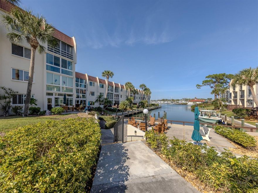 Experience coastal living at its finest in this beautifully updated end-unit residence, showcasing serene water views. In meticulous condition throughout. Nestled within the exclusive and sought-after Bella Costa community on Venice Island, this spacious 2-bedroom, 2-bath condominium offers exceptional comfort and style in one of the area’s most desirable locations. Step inside to a bright, inviting separate dining area. Adjacent find the well-sized kitchen featuring stainless steel appliances, granite countertops, and premium cabinetry overlooking the spacious living room, a great room to entertain and enjoy the wonderful Harbor Bay views. This generous living area flows seamlessly into an enclosed lanai, enhanced by floor-to-ceiling impact-resistant windows that frame lush garden scenery and the vibrant Intracoastal Waterway, perfect for relaxing or entertaining. Elegant plantation shutters and tasteful draperies elevate the home’s coastal sophistication, while the end-unit placement ensures added privacy and natural light. Bella Costa residents enjoy an unbeatable downtown lifestyle, located just steps from the Venice Theatre, charming boutiques, top-rated restaurants, and a short bike ride to Venice’s pristine beaches. With completed structural engineering and strong financials, Bella Costa offers peace of mind and long-term stability. This is an exceptional opportunity to own a move-in-ready waterfront retreat in the heart of Venice Island. Furniture included and most other items to be left as a courtesy to the buyer. Schedule your showing today and make this beautiful place your own.