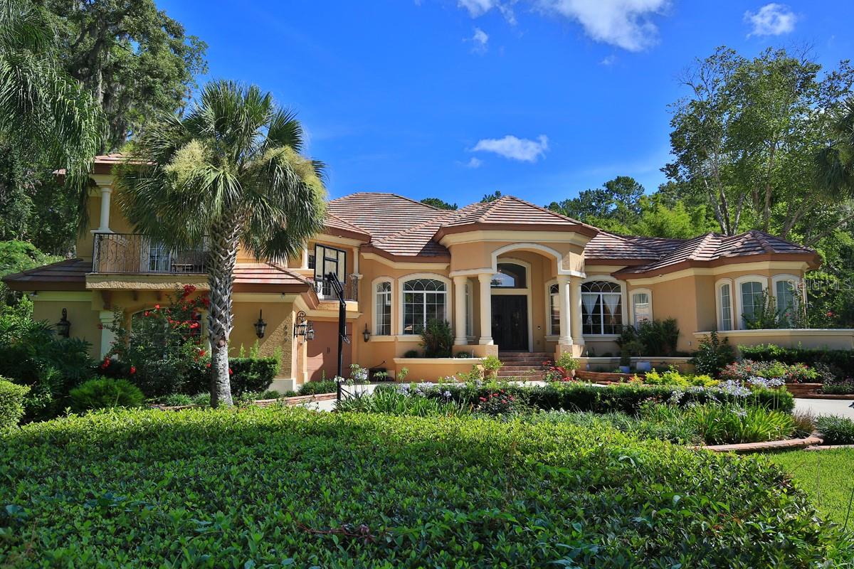 As you approach the elegantly paved driveway and beautifully mature landscaping, you will be amazed by this stunning, resort-style custom-built smart home nestled on an expansive lot, offering the ultimate outdoor entertaining lifestyle you’ve always desired. Located within the Laurels of Bellechase, this property features a secure 24-hour guarded entrance.
Step inside and be welcomed by a captivating living room featuring seamless glass doors that offer breathtaking views of the spectacular outdoor pool.
Four generously sized bedrooms, plus an office, are each thoughtfully arranged in a well-planned split-floor layout.
The gourmet kitchen is a chef's dream, featuring top-of-the-line appliances, beautifully crafted wood cabinetry, and luxurious granite countertops that invite culinary creativity. A stylish beverage bar adds an elegant touch, creating a seamless connection to the inviting family room, perfect for effortless family gatherings and entertaining friends.
The family room is designed for both comfort and functionality, showcasing custom-built cabinets that provide ample storage. Expansive stackable sliding glass doors open up to reveal a stunning outdoor oasis, complete with a fully equipped summer kitchen and a sparkling pool entertainment area.
For indoor entertainment, the home boasts a generously sized game room complete with a stylish bar, making it the perfect setting for a pool table. This inviting space is ideal for hosting lively game nights with friends and family, ensuring endless fun and laughter.
The indoor-outdoor experience seamlessly connects the vibrant entertainment areas with the sparkling pool outside. Whether it's a laid-back gathering or an energetic celebration, this home is designed for unforgettable moments.
The outdoor retreat boasts three entrances to the pool, a captivating park-like slide, a soothing hot tub, cascading waterfalls, drop down oversized screen and your very own cabana—equipped with poolside seating, a bar area, a 1,700+ bottle wine cooler display, a bath, and a smart TV, making it the perfect venue for entertaining any number of guests. Additionally, the property includes a charming 1/1 guest house and a personal gym.
Countless additional features await discovery in this must-see residence, and a virtual tour is available to explore every exquisite detail of this remarkable property.