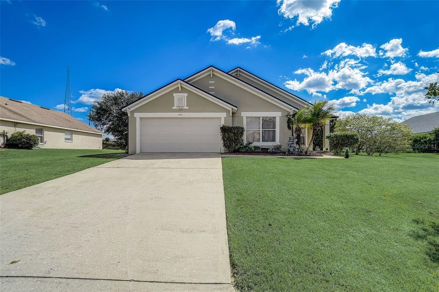 One or more photo(s) has been virtually staged. Outstanding value lower price!  Great value 4 bedroom ranch home. New roof 2023, New AC 2023, New carpet 2023, huge oversized garage. Covered entrance with a screen door, light oak kitchen with stainless steel appliances and an angled breakfast bar which overlooks the large living room space, four nice sized bedrooms. Primary with twin vanities, shower and a tub. This house also has a large screened in Florida room for a multitude of uses. Motivated sellers, located within easy reach of Hwy 27 with all its shopping, great schools and hospital are all close by.