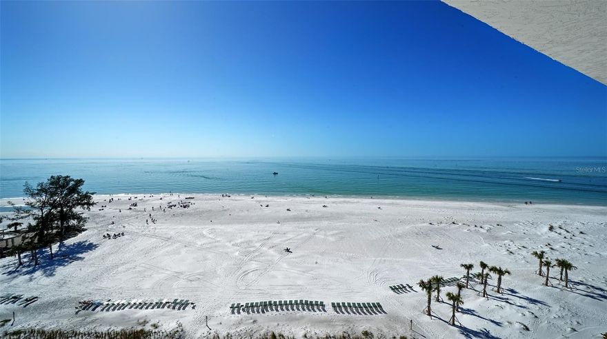 Welcome to this beautifully remodeled 11th floor GULF FRONT Whispering Sands tower residence – just one floor below the penthouse level – where sweeping, unobstructed FULL Gulf views meet breathtaking, colorful sunsets that paint the sky each evening. This light filled 2BR/2BA condo is the perfect combination of refined coastal style with effortless, comfortable living.  The bright open kitchen is designed for both entertaining and everyday elegance, featuring an expansive, 8-foot breakfast bar, granite countertops, Whirlpool, GE & KitchenAid appliances, recessed lighting, and a convenient built-in corner workspace.  NEW 2024 hurricane impact sliders frame your private, enclosed 24’ Gulf front balcony – the ideal space for enjoying peaceful morning coffee or sunset cocktails above the shoreline.  The tranquil primary suite features a walk-in closet and beautifully remodeled ensuite bath with spacious dual vanity and glassed walk-in shower.  A set of French doors with privacy shades leads to a flexible guest suite with twin Murphy beds & built-ins, easily transitioning from private office to welcoming bedroom. A second guest bath entry creates a true ensuite experience.  Thoughtful upgrades in this unit include track lighting, textured ceilings, remote-controlled overhead fans, and a whole-house water filtration system.  2024 HVAC.  Whispering Sands is a premiere 55+ Gulf front property on the westernmost point of Siesta Key, featuring 800’ of private quartz sand beach, 2 heated pools, clubhouse and Tower Lounge – both of which are in the initial stages of being completely remodeled – beachside Tiki Hut, gas grills, shuffleboard, canoe/kayak storage, and onsite management. You’re also ideally just around the corner from the colorful boutiques and dining options of Siesta Key Village!  Don’t miss this rare opportunity to own this sophisticated Gulf front residence that captures a true resort lifestyle while remaining warm, welcoming, and wonderfully livable.