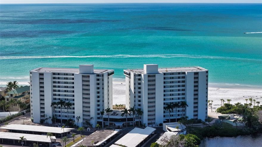 PRICE IMPROVEMENT!! Welcome to this beautifully remodeled 11th floor GULF FRONT Whispering Sands tower residence – just one floor below the penthouse level – where sweeping, unobstructed FULL Gulf views meet breathtaking, colorful sunsets that paint the sky each evening. This light filled 2BR/2BA condo is the perfect combination of refined coastal style with effortless, comfortable living.  The bright open kitchen is designed for both entertaining and everyday elegance, featuring an expansive, 8-foot breakfast bar, granite countertops, Whirlpool, GE & KitchenAid appliances, recessed lighting, and a convenient built-in corner workspace.  NEW 2024 hurricane impact sliders frame your private, enclosed 24’ Gulf front balcony – the ideal space for enjoying peaceful morning coffee or sunset cocktails above the shoreline.  The tranquil primary suite features a walk-in closet and beautifully remodeled ensuite bath with spacious dual vanity and glassed walk-in shower.  A set of French doors with privacy shades leads to a flexible guest suite with twin Murphy beds & built-ins, easily transitioning from private office to welcoming bedroom. A second guest bath entry creates a true ensuite experience.  Thoughtful upgrades in this unit include track lighting, textured ceilings, remote-controlled overhead fans, and a whole-house water filtration system.  2024 HVAC.  Whispering Sands is a premiere 55+ Gulf front property on the westernmost point of Siesta Key, featuring 800’ of private quartz sand beach, 2 heated pools, clubhouse and Tower Lounge – both of which are in the initial stages of being completely remodeled – beachside Tiki Hut, gas grills, shuffleboard, canoe/kayak storage, and onsite management. You’re also ideally just around the corner from the colorful boutiques and dining options of Siesta Key Village!  Don’t miss this rare opportunity to own this sophisticated Gulf front residence that captures a true resort lifestyle while remaining warm, welcoming, and wonderfully livable.