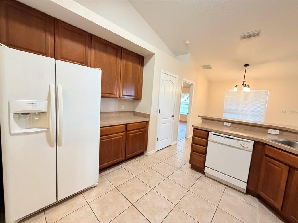 Photo of 10438 Vista Pines Loop, Clermont, FL 34711 (MLS # O6436717)