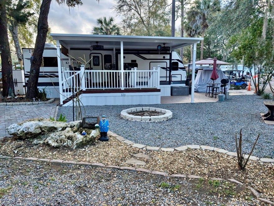 2021 Dutchman Kodiak Ultimate RV w/ 3 slide outs situated on a corner 4,744sqft lot. Lot features a 12’x12’ deck (2021), beautiful landscaping, pavers/rocks, fire pit, and 8’x10’ utility building with washer/dryer. The resort offers club house, 2 pools, hot tub, tennis courts, dog park, dock, & boat ramp to Little Lake Kerr. Perfect for weekends or fulltime residence.