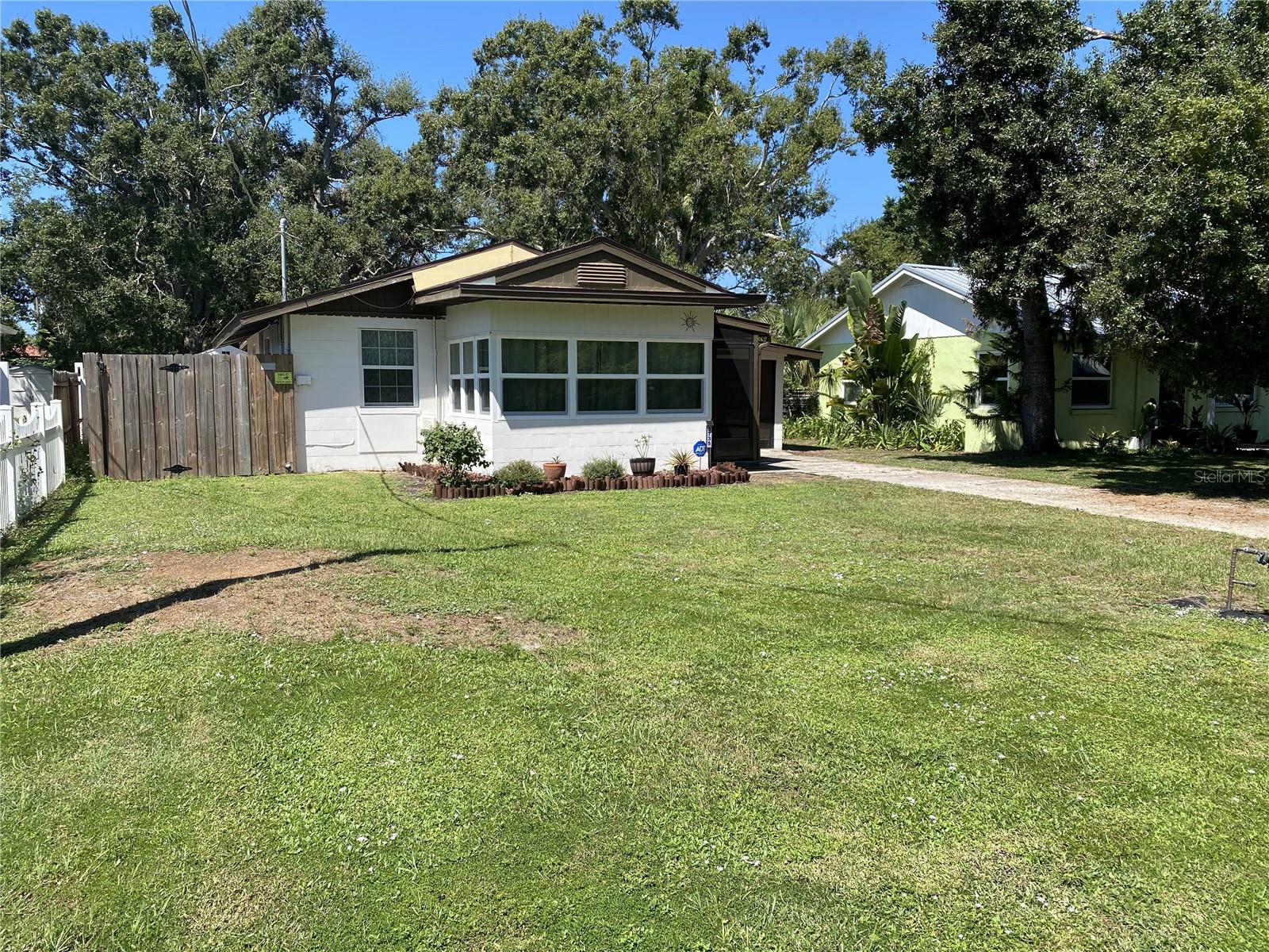 UPDATED WITH NEWER ROOF, WINDOWS, A/C AND MUCH MORE. LARGE YARD, CLOSE TO DOWNTOWN SARASOTA. NO HOA DUES.