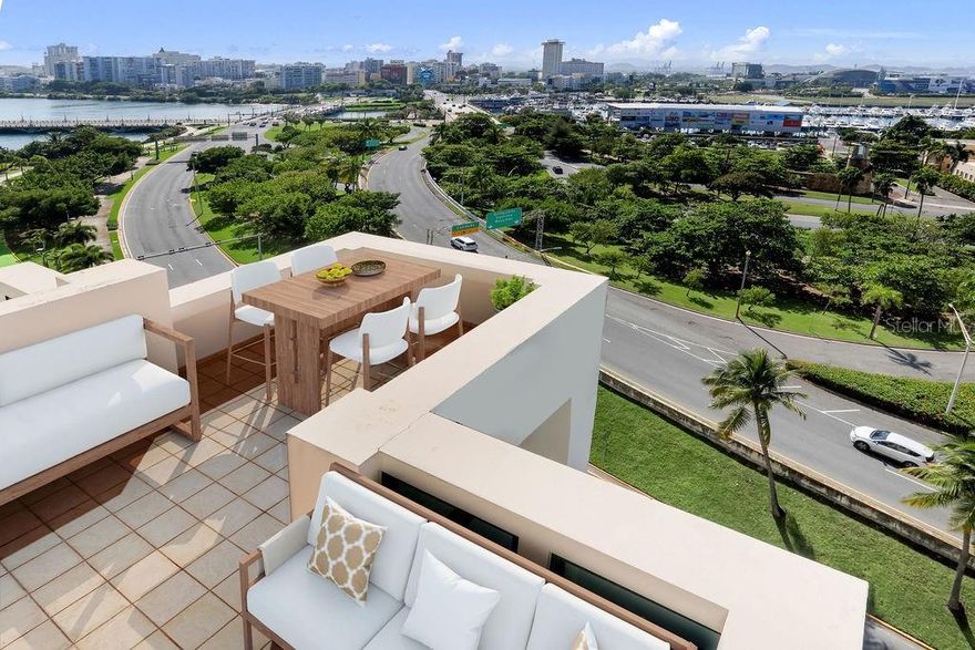 One or more photo(s) has been virtually staged. Welcome to 1003 Caribe Plaza! One of the few unique apartments in the building with a terrace, from which you enjoy exhilarating daytime and nighttime vistas of Luis Muñoz Rivera Park, San Juan Bay marina, Condado Lagoon, Miramar Skyline, the Convention Center, and Distrito T-Mobile. The unit spans 4,107 square feet across an expansive, one-level layout. Accessible via the key-fobbed elevator, the 10th floor opens to a private lobby leading to a grand living room connected to the terrace, as well as an adjoining dining room accommodating 10 persons comfortably. The family room provides park and ocean views, while the adjacent gourmet kitchen is equipped with top-of-the-line appliances. This unit's primary bedroom layout is among the largest in the building. Featuring a total of 3 bedrooms, plus a flex room, 4 full bathrooms, and 1 half guest bathroom. Luxury finishes adorn the space, with marble floors throughout and recently replaced security windows. Additionally, the unit includes 3 side-by-side parking spaces and a temperature-controlled storage room. A full-power backup generator powers the entire building, along with a water cistern. Caribe Plaza offers luxurious amenities, including concierge services, valet parking, visitor parking, and 24/7 security. Residents can enjoy a fully equipped gym, a heated pool, and an activity room. Conveniently situated steps away from the Luis Muñoz Rivera Park, the Caribe Hilton hotel, and the Escambron Beach, and with endless entertainment options nearby in Distrito T-Mobile and Old San Juan. Come enjoy living in one of San Juan’s finest residential addresses!