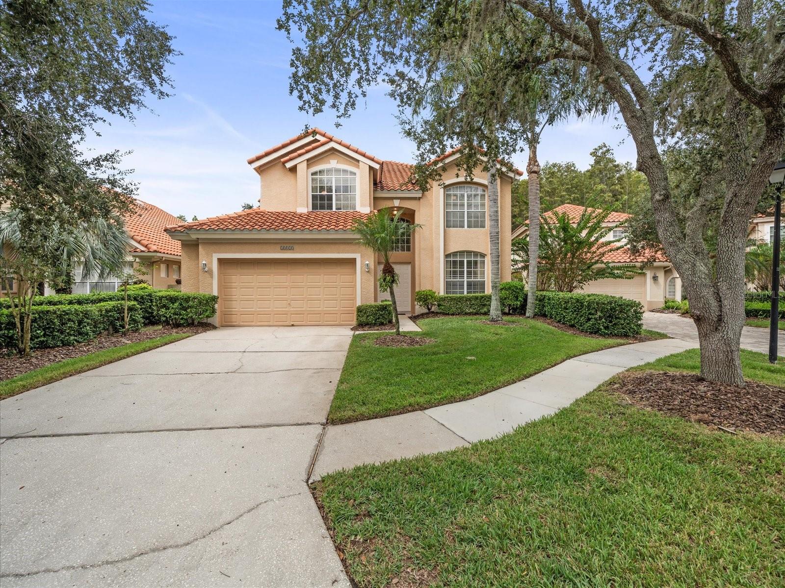 We are pleased to present this BEAUTIFUL TWO STORY HOME in Biarritz Village of Cheval. Situated on a GORGEOUS WATERFRONT/CUL DE SAC LOT WITH CONSERVATION VIEWS, this 5 Bedroom, 3.1 Bath, 3,251 sq. ft. home features a light and bright open floor plan with TWO STORY VOLUME CEILINGS in the kitchen, breakfast room, and foyer; a spacious kitchen with center island, two sinks, 42” upper cabinets and pantry; a large primary suite with vaulted ceiling and 2 closets; a DOWNSTAIRS GUEST BEDROOM that can double as an office; laundry room with loads of cabinets and laundry sink; enormous screened lanai with access to a dedicated pool bath; NEW TILE ROOF (2020); HOA maintained seawall (recently replaced); lush landscape and more!
Biarritz Village is accessed through a tree-lined avenue bordering a lake and the Cheval Golf Course. The 92 separate, single family homes all have a Mediterranean flair and style. This inner community has its own separate HOA whose primary responsibility is to maintain all the grounds surrounding all the homes. Cheval has 3 convenient entry gates, all of which are staffed 24/7. Cheval also offers easy access to the recently purchased Club at Cheval and to the TPC Club. Add to these GREAT SCHOOLS (McKitrick ES, Martinez MS, and Steinbrenner HS) and a convenient location for shopping, dining, parks, medical facilities and interstate travel, and you have a fantastic place to call home!