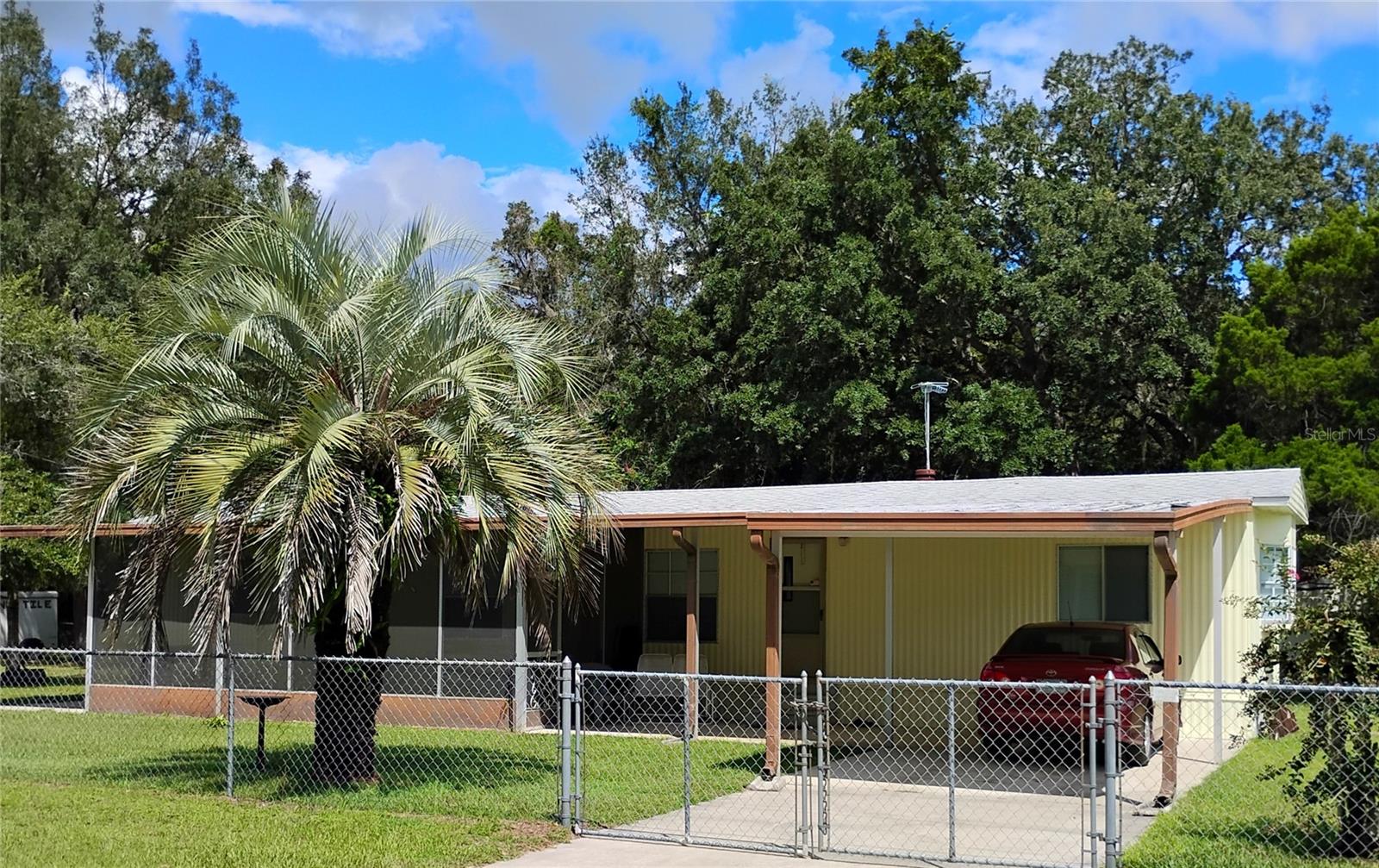 Welcome home to this cozy residence in Silver Springs—perfectly situated on nearly half an acre in the Oakwood subdivision. Priced to sell, this property offers 2 bedrooms, 2 full bathrooms, and approximately 840 sq ft of comfortable living space. Built in 1982, the home sits on a 0.42-acre lot, providing space for outdoor enjoyment, gardening, or expansion. The lot is a generous size and affords privacy while still being part of a welcoming rural community with no HOA. This home Features include a one-car carport for covered parking, and the home comes with basic utilities. Located with access to local amenities in Marion County, this property is an excellent opportunity for first-time buyers, investors, or someone seeking a peaceful retreat in a more rural setting. The home has been freshly painted and is move in ready!