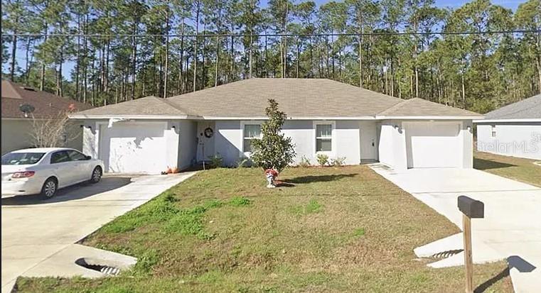 Photo of 26 Riddle Drive, Palm Coast, FL 32164 (MLS # OM732566)