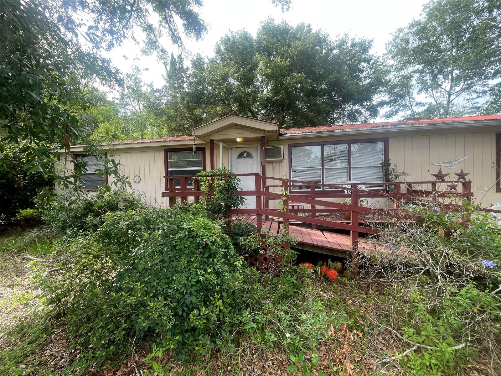Investor opportunity in Belleview! This home offers instant sweat equity and is perfectly positioned for rental or flip opportunities. Located just minutes from The Villages, Market of Marion, Downtown Ocala, and the World Equestrian Center, the property sits directly in the path of Central Florida’s ongoing growth and development. The home features a large master bedroom with a walk-in closet and an oversized bathroom that was previously configured as a bedroom. Key systems have been updated, including a 2021 HVAC, a metal roof with no known leaks, and PVC plumbing estimated to have been replaced around 2015. A new water heater was installed in April 2025. These updates provide peace of mind and enable new owner to focus on the needed cosmetic work. Home operates on well and septic. The property does need work, making it ideal for investors seeking a value-add project. The property is being sold strictly as-is, as-seen, with all personal property to remain. The seller has never occupied the property. All information provided is from the seller/owner and believed to be accurate but is not guaranteed. Buyers are responsible for verifying all information and performing their own due diligence. Inspections are for informational purposes only, and the seller will make no repairs.
