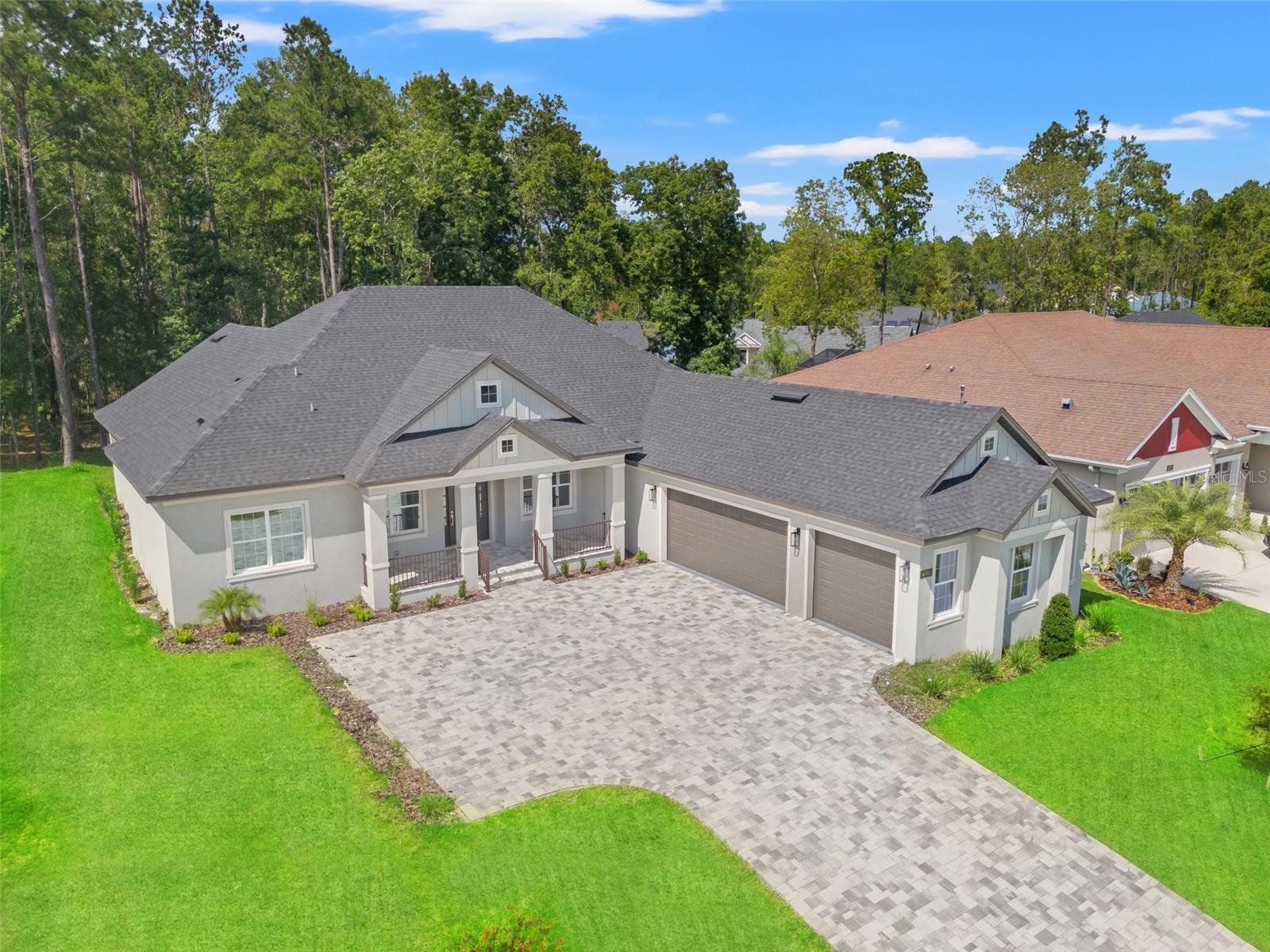 Welcome to refined living in this brand-new, move-in-ready 3-bedroom, 3-bathroom home, thoughtfully designed with a split open floorplan in the prestigious Southern Hills community, featuring a Pete Dye-designed golf course. This elegant residence showcases modern selections, including sleek quartz countertops and a state-of-the-art chef's kitchen, perfect for seamless meal preparation and entertaining. The master suite offers serene views, a spacious walk-in closet, dual vanities, a soaking tub, and a separate shower. Enjoy outdoor living with a fully equipped summer kitchen, ideal for al fresco dining and views of the greenspace beyond the yard. The open-concept living area, with high-end finishes and abundant natural light, blends sophistication and functionality. A spacious laundry room, complete with washer and dryer, adds everyday convenience. With an oversized paver driveway and a 3-car garage, this home offers ample parking and storage. Nestled in an exclusive golf course community, this residence combines modern luxury with timeless practicality. Call today to schedule a private tour.