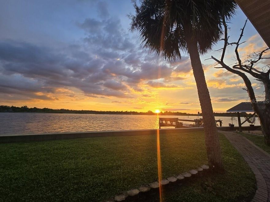 This charming retro ranch-style home is perfectly situated on a prime waterfront lot along highly sought-after John Anderson Drive, offering 125 feet of direct Intracoastal Waterway frontage with breathtaking views of the Tomoka Basin. A true boater’s paradise, this property features a private dock and seawall, built in 2016 providing effortless access to boating, fishing, paddleboarding, and kayaking right from your backyard. The roof was replaced Nov of 2019, a brand-new wood deck off the kitchen was rebuilt in 2025. The rear porch was added in 2006. 
Inside, the home blends mid-century charm with modern comforts. Expansive windows flood the living spaces with natural light while showcasing spectacular water views from nearly every room—even the garage. The spacious living area offers a cozy fireplace, creating a warm and inviting atmosphere, while the gourmet kitchen is a chef’s dream, complete with a built-in pizza oven. The master bedroom and kitchen open to a private deck, perfect for morning coffee or evening relaxation while overlooking the water. The family room features glass sliding doors that lead to a screened-in, covered patio, offering additional indoor-outdoor living space ideal for entertaining or simply enjoying the serene waterfront setting. The home has hurricane shutters and has never flooded to the knowledge of the current owner.
The owner also has plans available for a larger custom residence, offering a unique opportunity to expand or build new on this exceptional lot. Don’t miss your chance to own this one-of-a-kind waterfront retreat. Schedule your private tour today!