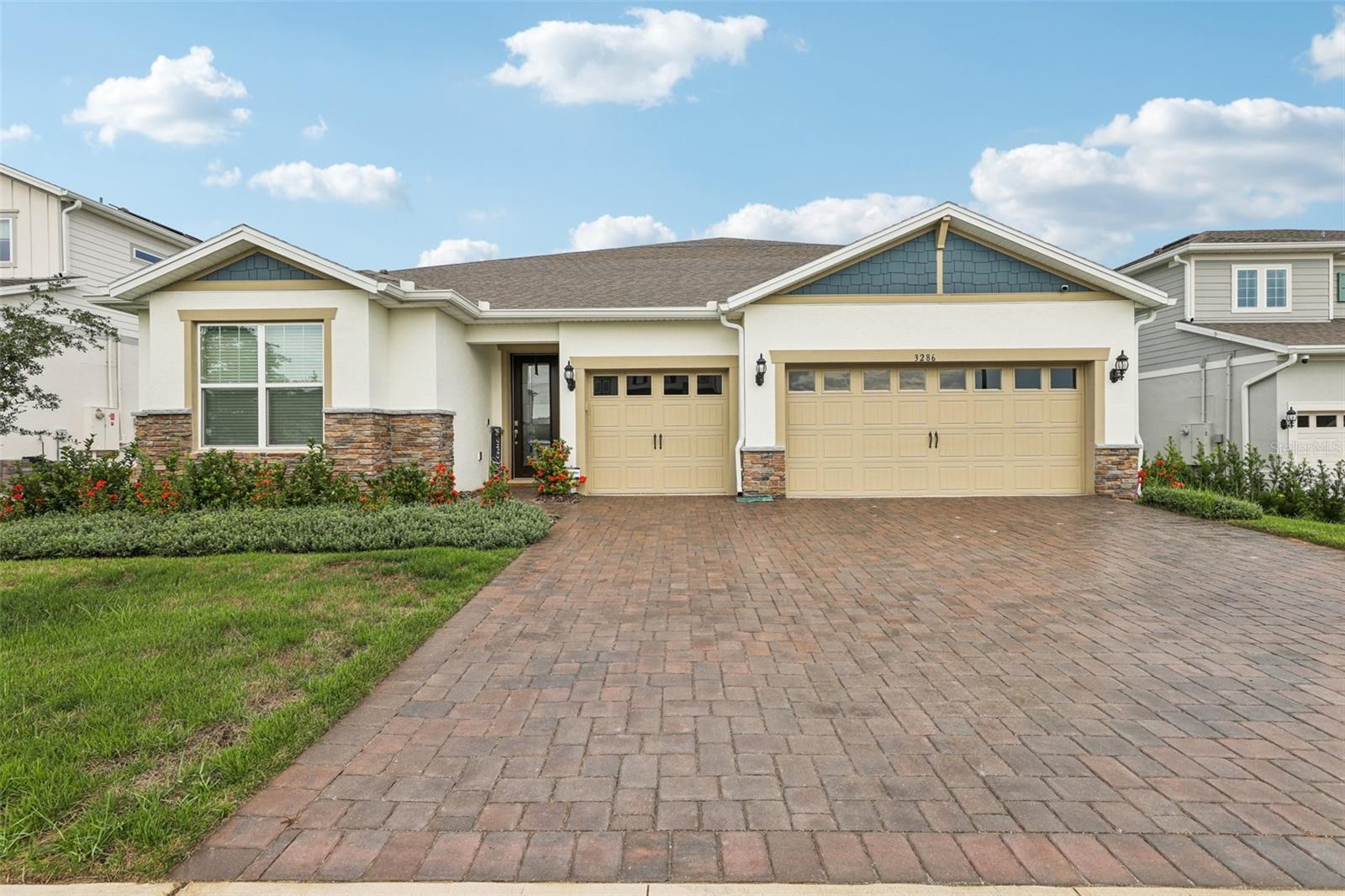 Welcome to this beautiful, like-new 2023 Pulte home, filled with custom upgrades and designed for modern living. With five bedrooms and four bathrooms, there's plenty of room to spread out in this spacious, open-concept floor plan. The main living areas and primary suite feature warm oak laminate flooring for a seamless, elegant flow. A spacious foyer leads you to a semi-private dining room with charming wainscoting. The great room is a true centerpiece, boasting a floor-to-ceiling stone fireplace with built-in shelving and opening to a stunning eat-in kitchen. The kitchen is a chef's dream, complete with upgraded cabinets, a large island with seating, stone countertops, stainless steel appliances, a tile backsplash, and an oversized walk-in pantry. A sunny breakfast nook offers the perfect spot for casual meals.
The primary suite is a private retreat with a trey ceiling and a floor-to-ceiling stone wall. It features a massive walk-in closet and a luxurious en-suite with a tile shower. The main level also includes a dedicated office with glass doors, two additional bedrooms each with private en-suites, and a laundry room with a utility sink and built-in cabinetry. Upstairs, you'll find an oversized bonus/gathering room, a media room (which could serve as a sixth bedroom), two more spacious bedrooms with walk-in closets, and a full bathroom with a dual vanity and a tub-shower combo. Outdoor living is just as impressive with a paver driveway leading to a three-car garage. The covered paver patio and a nice-sized yard offer the perfect space for relaxation or entertaining. Located within the exceptional gated community of Lakeview Preserve, you'll have access to resort-style amenities, including a pool, playground, clubhouse, fitness center, and scenic trails. The home's prime location provides easy access to schools, shopping, dining, and all of Orlando's world-class attractions and amenities.
Schedule a private tour!