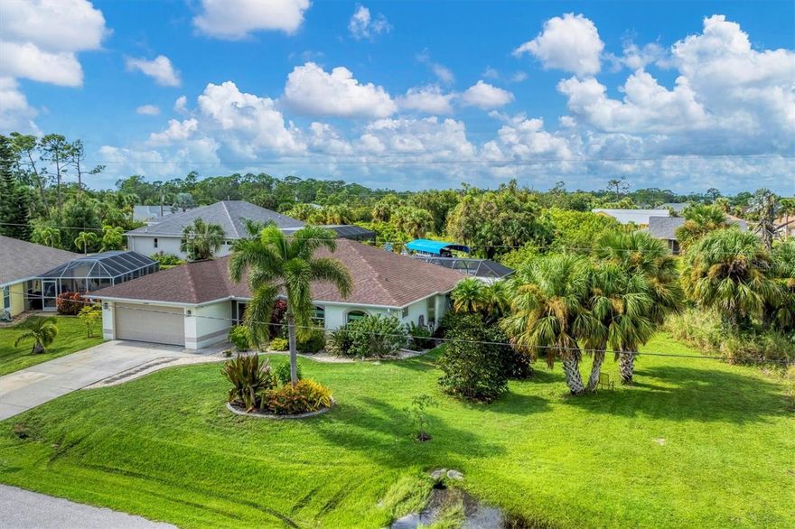 It’s time to embrace the true Southwest Florida waterfront lifestyle. This high and dry 3 bedroom, 2 bathroom pool home delivers quick, direct access to the Myakka River, Charlotte Harbor, and the Gulf of Mexico—no long idle zones, no wasted time, just effortless boating days whenever the mood strikes. Inside, nearly 1,700 square feet of comfortable living space features high ceilings, tile throughout, and the always popular split floor plan for privacy and easy flow. The kitchen sits at the heart of the home with stone countertops, a breakfast bar, and a convenient pantry, while the interior laundry room (with washer, dryer, and utility sink) keeps daily living simple. But the real magic happens outdoors. Step through the sliders to your expansive screened pool area, complete with a large covered patio—the perfect all weather space for lounging, dining, and entertaining. The solar heated pool overlooks your private waterfront, where a dock, 6,000 lb boat lift, and 80 feet of concrete seawall set the stage for endless days on the water. Cast a line for snook, redfish, or snapper, or watch for dolphin and manatee gliding by.
This home is storm ready and energy smart, offering impact windows and doors, hurricane shutters for the few windows that are not impact resistant, a newer roof, heat pump AC and water heater, solar heated pool with temperature control, and a high efficiency variable speed pool pump. Gulf Cove is a beloved community of boaters, walkers, bikers, and friendly neighbors. With no deed restrictions and an optional low cost property owners association (including access to the private boat ramp), you can tailor your lifestyle exactly as you wish. Come see why life feels lighter, brighter, and happier in Gulf Cove. Schedule your private tour today and start living the waterfront dream.