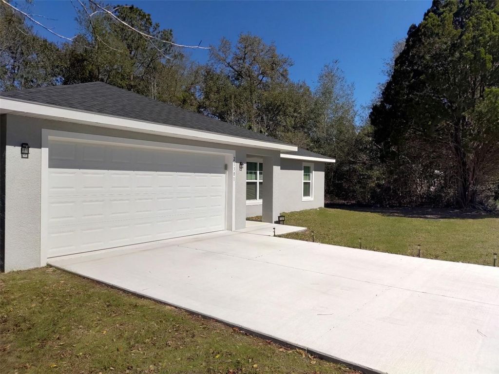 Photo of 21301 SW Rainbow Lakes Boulevard, Dunnellon, FL 34431 (MLS # OM721424)