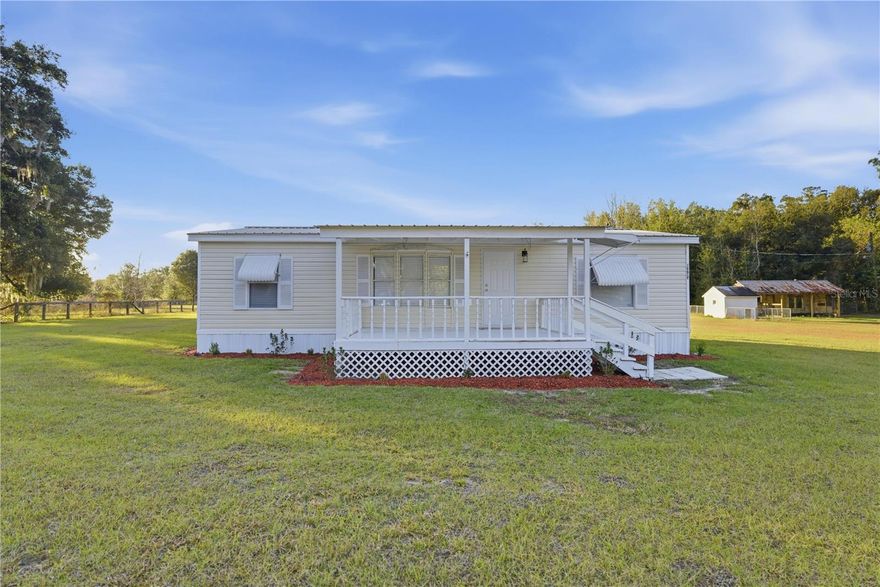 Discover peaceful country living in this beautifully updated home on 3.98 acres, zoned A1 and perfect for horses or hobby farming. The property is mostly fenced and includes pasture spigots, making it easy to bring your animals or outdoor projects to life. Enjoy wide-open space for gardening, recreation, or simply relaxing in a quiet rural setting.

Inside, the home feels bright and welcoming with 2025 updates including new flooring, fresh interior paint, new blinds throughout, and ceiling fans in every room. The kitchen is both stylish and functional, and the comfortable living areas offer plenty of natural light. Additional features include Metal roof, Covered front porch with fresh exterior paint, New landscaping for added curb appeal, Move-in ready condition, Convenient location with easy access to Gainesville, Ocala, and all of Central Florida. A wonderful opportunity to own a turnkey country home with acreage in Marion County—ready for your horses, your hobbies, and your lifestyle.