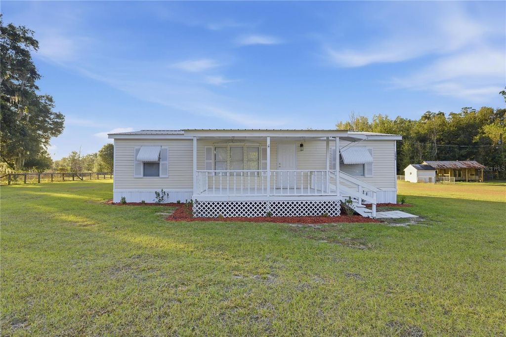 Photo of 13705 NE 14th Avenue, Citra, FL 32113 (MLS # OM714815)