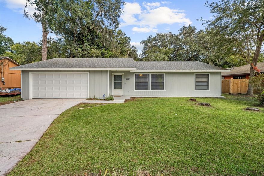 Move-in ready and beautifully remodeled! This stunning 3-bedroom, 2-bath home is just 20 minutes from the beach and packed with upgrades. Enjoy peace of mind with a 2021 roof, newer AC and water heater, and fresh interior and exterior paint. Inside, luxury vinyl flooring flows through an open living and dining area, leading to a sleek kitchen with new cabinets and quartz countertops. The split floor plan offers privacy, while the primary suite features private patio access. Relax on the screened back porch surrounded by lush landscaping. Conveniently located near major roads, shopping, dining, and entertainment.
