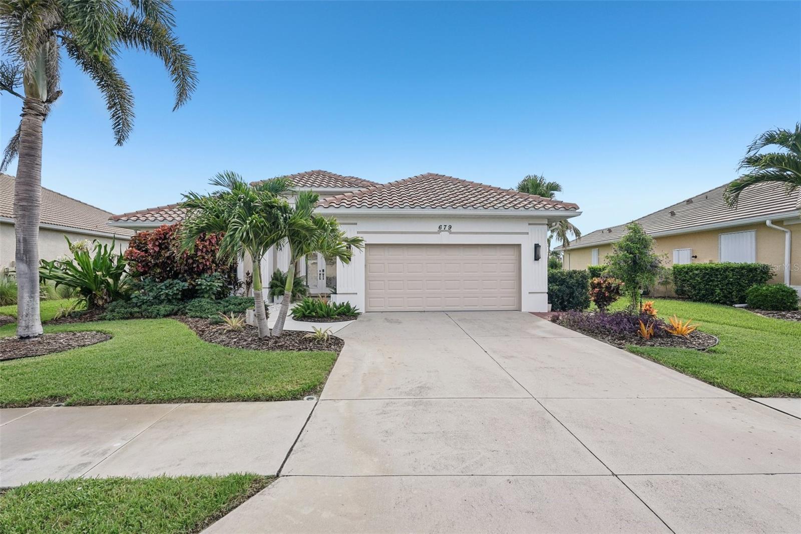 Welcome to your private waterfront retreat in the sought-after Lakes of Jacaranda. This beautifully maintained, like-new lakefront pool home offers a rare opportunity to enjoy luxurious Florida living without the wait of new construction. Inside, you’ll find a spacious open layout featuring volume ceilings, crown molding, and elegant ceramic tile laid on the diagonal. The chef’s kitchen is a standout with granite countertops, solid maple cabinetry, custom lighting, and an aquarium window framing stunning lake views.
The primary suite offers a peaceful escape with a dual-sink vanity, custom-tiled walk-in shower, and refined finishes throughout. Upgraded light fixtures, ceiling fans, and custom window treatments complete the polished interior.
Step outside to your private brick paver patio and heated pool with a tranquil waterfall, all set against the serene backdrop of Lake Meredith. Whether relaxing poolside or entertaining guests, this outdoor space is designed to impress.
Additional highlights include very low annual HOA fees and no flood zone designation for added peace of mind.
Schedule your private tour today. This lakefront gem is not to be missed!