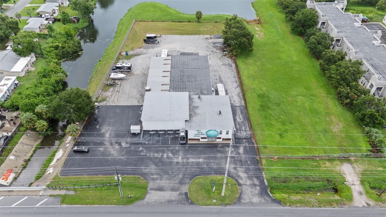 Wording description - located just a short distance from downtown St Pete, in the popular Joes Creek industrial area, this property encompasses a mix of office, warehouse, and a large covered canopy over 1.48 acres - multiple dock high overhead doors - newer roofs, A/C, windows, etc - perfect for service companies or businesses that need a lot of parking, or there is certainly room to expand by adding square footage - county grants available in this Lealman Community Redevelopment district.