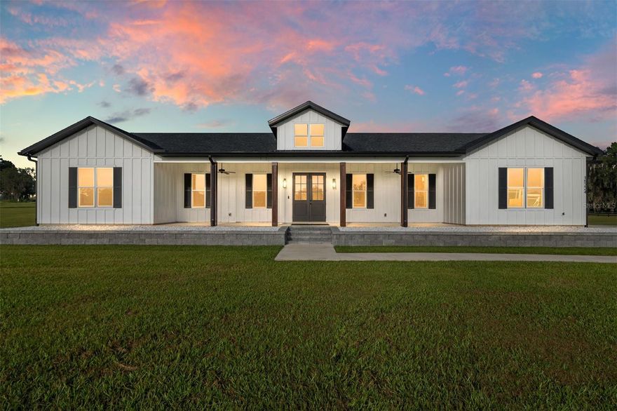 Experience Ocala Horse Country like never before with this 2022 custom-built, 4-bedroom, 3.5-bath modern estate. With 2,689 sq. ft. under air (4,313 under roof), soaring 10’ ceilings, and vaulted living and primary suites, every detail has been designed for elegance, comfort, and lifestyle. The chef’s kitchen features upgraded appliances, gas range, an oversized island, and a hidden walk-in pantry. The resort-style primary suite includes a spa shower and vaulted ceilings, while Jack & Jill bedrooms and porcelain tile throughout make daily living effortless. Step outside to your private resort: a saltwater pool, hot tub, expansive covered porches, and 10 acres of partially fenced pasture shaded by majestic live oaks. What makes this property truly extraordinary? It sits on three separate parcels, giving you flexibility few properties : keep it all as a private estate, add a barn, guest house, or even a second residence. The current owner — also the builder — is willing to negotiate custom additions after closing, tailoring the property to your vision. Located on a private road yet minutes from the World Equestrian Center and downtown Ocala, this estate offers luxury, land, and investment opportunity all in one.