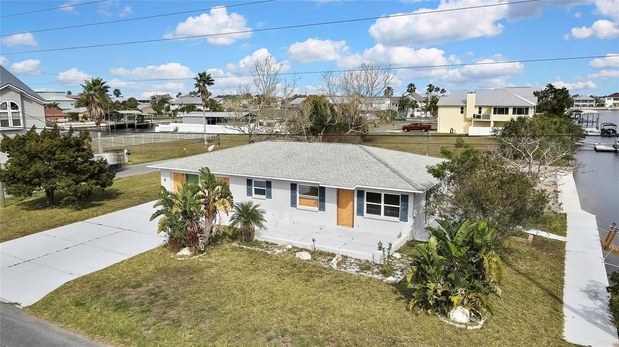 Investor Opportunity. Home is a Fixer Upper due to Hurricane Flood and Wind Damage. Sold As Is. Waterfront, Southern-facing block home is a must-see for investors! Offering Direct Gulf Access, no bridges or boat lift. Enjoy the stunning views of the marsh across the street, waterfront canal, and spectacular sunsets, this 2-bedroom, 2-bath, 2 car garage property offers. Completely gutted following Hurricane Milton, and it's being sold in as-is condition. With 60 feet of seawall and a floating dock, this home is perfect for boating enthusiasts. There are no HOA fees, no CDD and no short-term rental restrictions currently in the county, providing you with flexibility and opportunities for income with long term, short term or Air BnB rental. There are Beaches and Parks a short drive away. Local in community are restaurants, marinas, and public boat ramps. Easy commute to Tampa Bay and Orlando areas. Don't miss your chance to create something special—schedule your showing today! * Buyers should conduct their own inspections, and due diligence they deem necessary, including and not limited to county regulations*