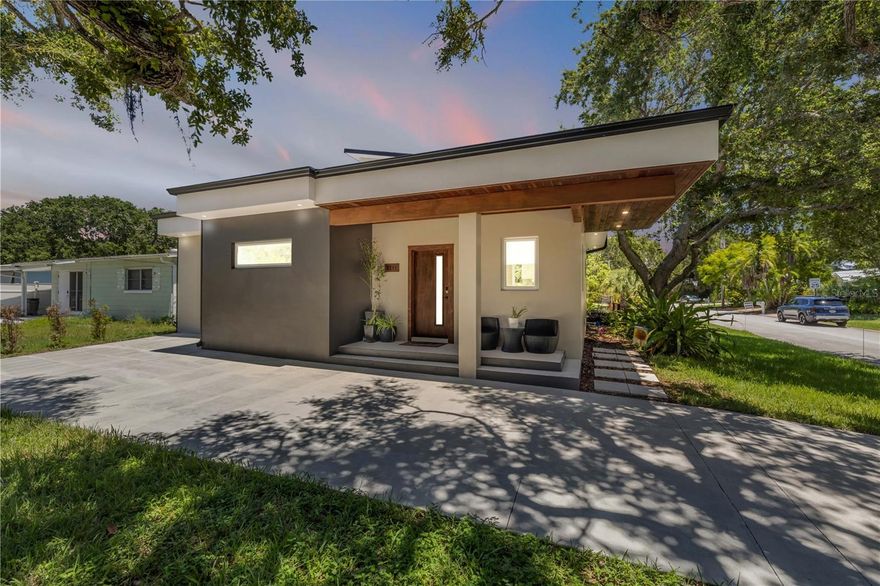 One or more photo(s) has been virtually staged. Luxury Coastal Living with Detached Apartment – Steps to the Beach & Lagoon Access - OWNERS ARE WILLING TO GIVE A CONCESSION FOR A POOL!!!!! Talk about having your cake and eating it too!!!! ***CHECK OUT THE PICS OF THE PROPOSED POOL DONE BY ALL AQUA POOLS***

Welcome to 3211 Saxon Drive, where luxury meets lifestyle in this contemporary coastal retreat just moments from the beach. This thoughtfully designed property features a 3-bedroom, 3-bathroom main residence, paired with a fully equipped 1-bedroom, 1.5-bath apartment above a detached oversized 2-car garage—perfect for guests, multigenerational living, or potential rental income.

As you arrive, you're greeted by a stunning historic oak tree that stretches over the circular driveway, creating a dramatic and welcoming entrance with ample parking for multiple vehicles. Step inside to discover polished concrete floors and a seamless flow throughout the home. The first floor includes two spacious guest bedrooms - each with windows that frame lush, leafy views so it feels like youre nestled high in the tree tops - a stylish full bathroom, a functional mudroom/laundry area, and a flexible den or office space where sunlight filters through the greenery beyond the glass.

At the heart of the home is a light-filled great room and chef-inspired kitchen boasting Café appliances, an Electrolux double-door fridge/freezer, 42” custom cabinetry, a hidden walk-in pantry, and a stunning 12’ island—ideal for entertaining. Expansive windows invite natural light and showcase the surrounding canopy of mature trees, creating a serene and private atmosphere. A soft neutral palette is warmed by natural wood accents, bringing balance and sophistication to the modern aesthetic.

Upstairs, the private owner’s suite spans the entire second level, featuring both reach-in and walk-in closets, a large private balcony overlooking the backyard, and a luxurious en suite bath complete with a pass-through shower, double vanity, and private water closet. From every upstairs window, you're treated to tranquil, elevated views - branches swaying in the breeze and dappled sunlight that feels like you're living in a treehouse retreat.

Step outside to a backyard oasis with room to bring your dream pool to life. Beyond the grassy lawn lies the detached garage and apartment, accessible via a separate driveway. The apartment includes a kitchenette, living space, full bath, private bedroom, and its own balcony with views framed by green foliage, offering the same peaceful, treetop like experience. 

Location is everything—and this home delivers. You're just a short stroll to the beach and a hidden neighborhood trail that leads directly to the Mosquito Lagoon Aquatic Preserve. Launch your kayak or paddleboard, cast a line, or simply take in the sunset over the water.

3211 Saxon Dr is more than a home—it's a lifestyle. Don’t miss this one-of-a-kind New Smyrna Beach gem.