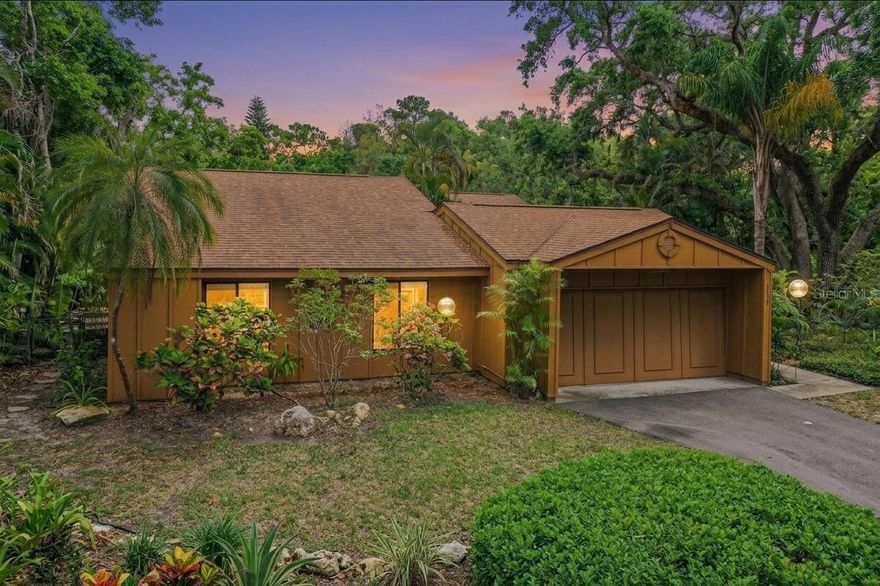 Welcome to Tanglewood! A rare opportunity to purchase in a well-established West Bradenton community known for its mature oak canopies and lush landscaping. Tanglewood is a recognized bird sanctuary and environmental preserve. The pond on this property is home to a variety of turtles, waterfowl, and fish.

The property itself is a real jewel! This single-family home is the largest model in this development. It is located at the back of the neighborhood on a cul-de-sac, offering one of the largest and private lots in the community. This stunning home features an open concept design with 3 bedrooms and two bathrooms. A high vaulted ceiling, long sight lines, and many glass doors/windows enhance natural light throughout. A true indoor-outdoor flow from the floors up!

The primary bedroom's sliding glass door opens to the backyard. A French door separates the ensuite bathroom and large walk-in closet, and the bathroom features a walk-in shower with a large, mirror-tinted window facing the pond. From the shower, it feels like you are outside—yet completely private.

The split floorplan separates the second and third bedrooms from the primary bedroom, offering privacy and quiet. The secondary bedroom has a large closet with hanging space and built-in shelving. The additional bedroom features double French doors and is ideal for an office or den. Both have large west-facing windows with great views of the landscaping and trees. These two bedrooms are served by a separate full bathroom.

The large studio kitchen features newer Samsung glass-front appliances (refrigerator and range) with plenty of workspace, under-counter storage, a shelved pantry, and a breakfast counter facing the dining and living areas. The multi-vehicle garage has built-in storage shelves, a workbench, and washer/dryer hookups (appliances included). The water heater and AC air handler are conveniently located in the garage for easy servicing. Updates include: water heater (2019), roof and air conditioner (2020), and Hardie siding (2022).

The property is just south of G.T. Bray Park and conveniently located near Blake Hospital, along with many other medical facilities, labs, and clinics. Centrally located, this property is close to retail shopping, grocery stores, downtown, restaurants, marinas, and the award-winning Bradenton beaches. Located approximately 7 miles from Anna Maria Island! Truly centrally located to all that Florida life has to offer!

The Tanglewood association fees include lawn care, irrigation, and cable. Amenities include a heated pool with bathrooms and showers, tennis and pickleball courts, common areas, and a pond viewing deck. 
Schedule your private showing today.