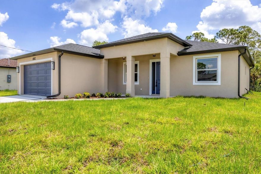 Brand-new modern classic luxury home featuring 3 bedrooms, 2 bathrooms, and a fully enclosed office (optional 4th BR) with soaring 9.4' ceilings. Located in a prime area with no HOA and outside the flood zone. Interior showcases Spanish porcelain tile throughout, impact-resistant windows and doors, and an open-concept living space with large double doors leading to a tiled lanai overlooking a peaceful freshwater canal. The chef’s kitchen includes quartz countertops, 42" soft-close cabinets, under/over cabinet lighting, stainless steel appliances, range hood, and stylish backsplash. The primary suite offers a walk-in closet and spa-like en-suite bath with a double vanity, linen closet, and walk-in shower with bench. Both bathrooms have full-length tiled shower walls. MOEN plumbing fixtures are featured throughout the entire home for consistent quality and style. Additional highlights: Interior laundry room with sink, seamless gutters, quartz windowsills, and designer lighting throughout.