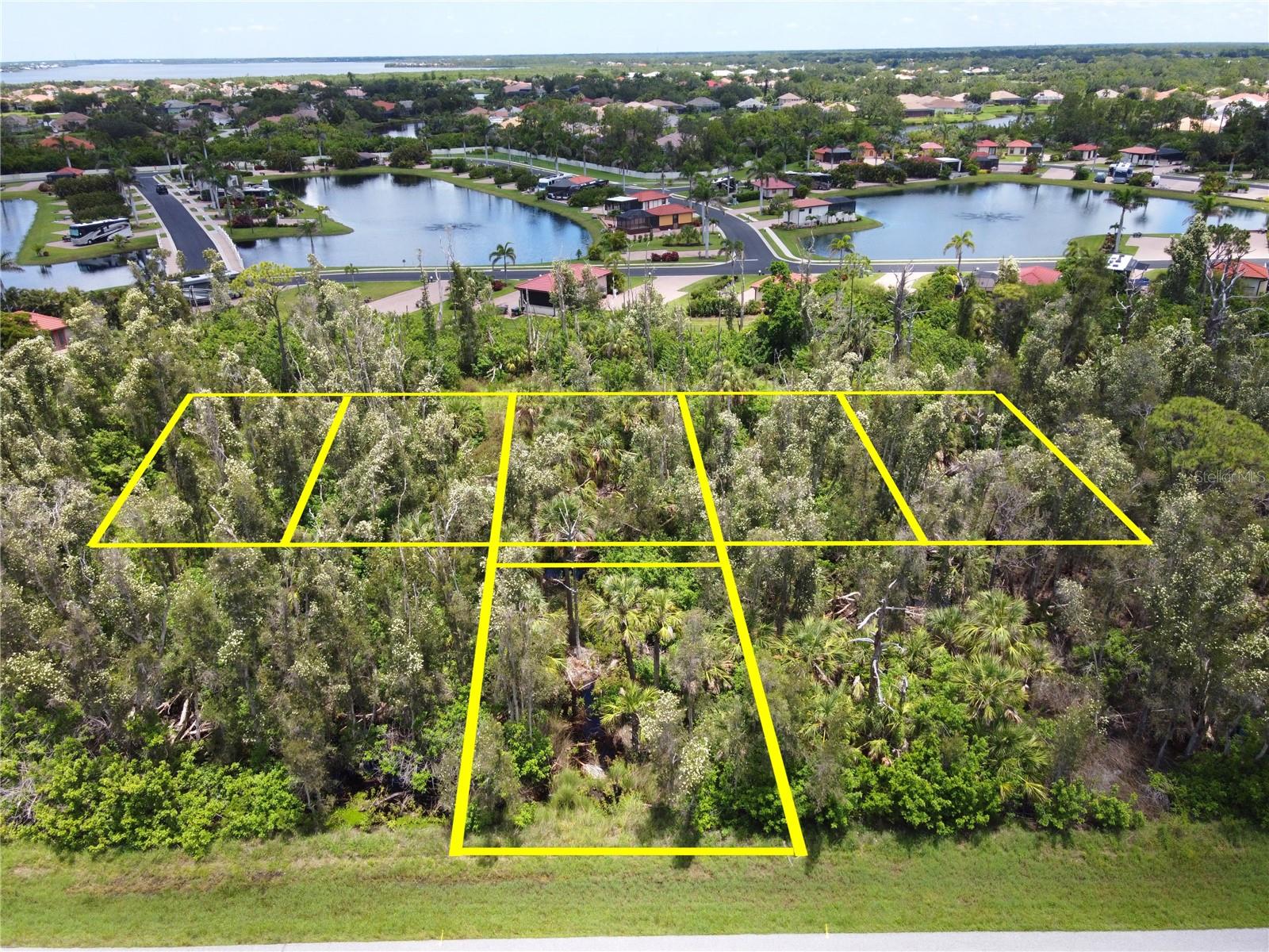 The seller's change of plans is now YOUR OPPORTUNITY! Six lots being sold as a package! This is the PERFECT LOCATION, approximately 70 yards from the water. If you choose to use the current building plans you will have views of The Peace River, Myakka River and Port Charlotte Harbor. Bring your vision with approximately 3/4 of an acre or if you desire, the plans have already been done and ready to build. The plans are for a 2-story home with almost 3000 sq. ft. under air and almost 7,000 sq. ft. under roof. The lots have been surveyed, topographical completed, soil tested, and health department approved. It was bush hogged about a year ago. If you choose to use the seller's plans, they will take that into consideration. Elevation certificates and survey's available upon request. NO HOA, NO CDD fees! Lot numbers 120, 121, 122, 123, 124 & 127 must be sold together. Start building your dream home today!