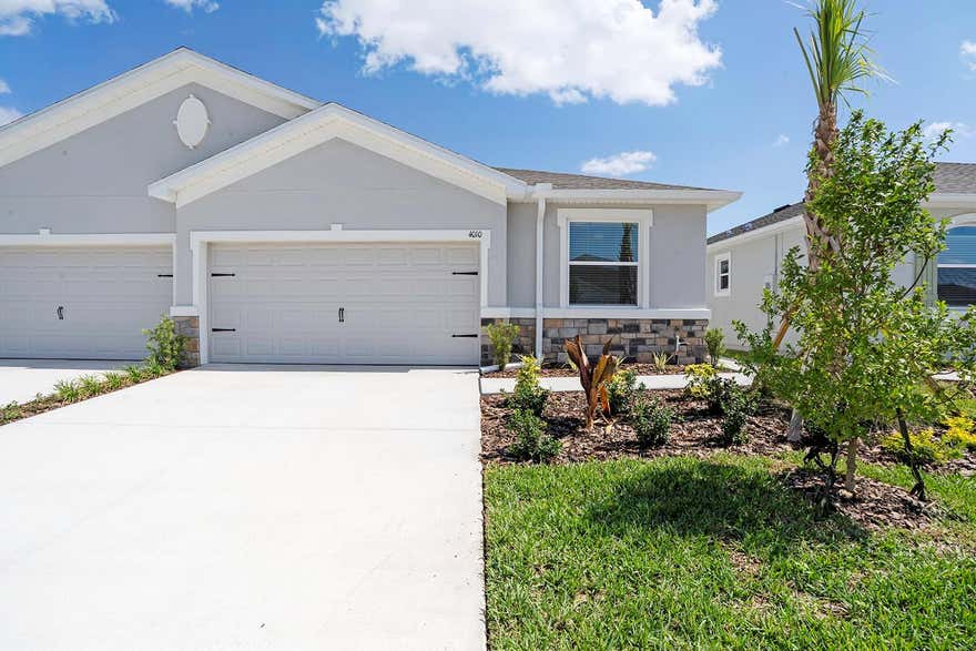 One or more photo(s) has been virtually staged. ATTENTION RENTERS! Welcome to your new home in the highly desirable Farm at Varrea community! This modern 3-bedroom, 2-bath villa offers a bright and open floor plan with elegant finishes throughout. The spacious kitchen features quartz countertops, stainless steel appliances, and a large island perfect for meal prep or entertaining. The open-concept living area is filled with natural light through sliding glass doors leading to a private covered lanai. The primary suite includes a walk-in closet and an en-suite bathroom with double vanities and a walk-in shower. Enjoy the convenience of in-unit laundry and a 2-car garage with plenty of storage space. This smart home includes integrated features such as a smart door lock, video doorbell, smart thermostat, smart switch, garage door control, and central smart home panel, all conveniently controlled through an app. Residents of Farm at Varrea enjoy resort-style amenities including a clubhouse, pool, fitness center, playground, and more. Conveniently located just minutes from I-4, downtown Plant City, and Lakeland, this home offers the perfect blend of comfort, style, and convenience. Available now, schedule your showing today! Tenant will pay $125.00 tenant processing fee at move in along with and rent and deposit(s). A non-refundable pet fee will be due at move in as well, if applicable.
