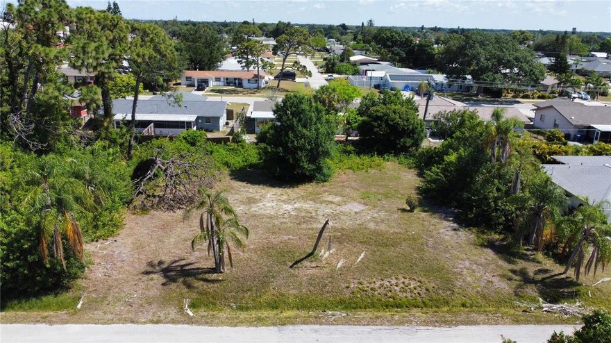 Great triple Lot in South Venice to build your dream home. Lot already cleared. Great central location close to shops and a number of different beaches. A little over 1/4 an acre. Not in a Flood zone! No CDD or HOA ! Electric available. Neighborhood ferry and boat launch available for small fee. Don't miss this opportunity today to build your dream home on this beautiful oversized lot.