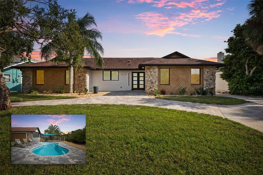 Your coastal lifestyle in Flagler Beach is here — just steps from the sand and only five homes from the Intracoastal. Spectacularly remodeled and exquisitely appointed, this waterfront residence on a saltwater canal offers a private dock, new pool, and brand new luxury finishes throughout.

The chef’s kitchen is a showpiece, featuring quartz counters, a built-in refrigerator, and a commercial gas range. The dining room includes a built-in wine bar with a double wine refrigerator — perfect for entertaining. An open great room with vaulted ceilings, stone fireplace, and dual sets of sliders seamlessly connect indoor and outdoor living.

The thoughtful floor plan includes 4 bedrooms and 3.5 baths. The primary suite is a retreat with dual sinks, a walk-in shower with rain and handheld fixtures, and a large, custom walk-in closet with built-ins. One guest bedroom — large enough to serve as a second primary — enjoys a private ensuite bath, while the remaining two bedrooms share a Jack-and-Jill designed bath, ensuring every bedroom has direct bathroom access. A powder room is conveniently available for guests. Additional features include a separate laundry room with washer, dryer, built-in cabinetry, and folding area, plus an 650 sq. ft. oversized two-car rear accessed garage through with an 18' garage door and access to the backyard bar and entertainment space.

Outdoor living is equally impressive. A large screened, pavered and covered lanai with a built-in summer kitchen and a playful surfboard-topped bar by the pool create an entertainer’s paradise. The property showcases a low-maintenance paver and concrete driveway with an electronic privacy gate, while the backyard and driveway feature modern paver stone inlays surrounded by artificial turf for a clean, upscale finish. Energy-efficient geothermal heat pump systems provide heating and cooling, while new impact-resistant casement windows further enhance comfort and peace of mind.

Beyond your dock, enjoy quick access to the Intracoastal Waterway for boating, inshore fishing, or ocean excursions. Just blocks away, Flagler Beach offers a laid-back, golf cart or walkable coastal lifestyle with its iconic pier, vibrant downtown restaurants and shops, and abundant opportunities for recreation on both land and water.

This is a rare opportunity to own a fully remodeled, turnkey home that combines premium finishes, thoughtful design, private dockage, and a sought-after coastal location.