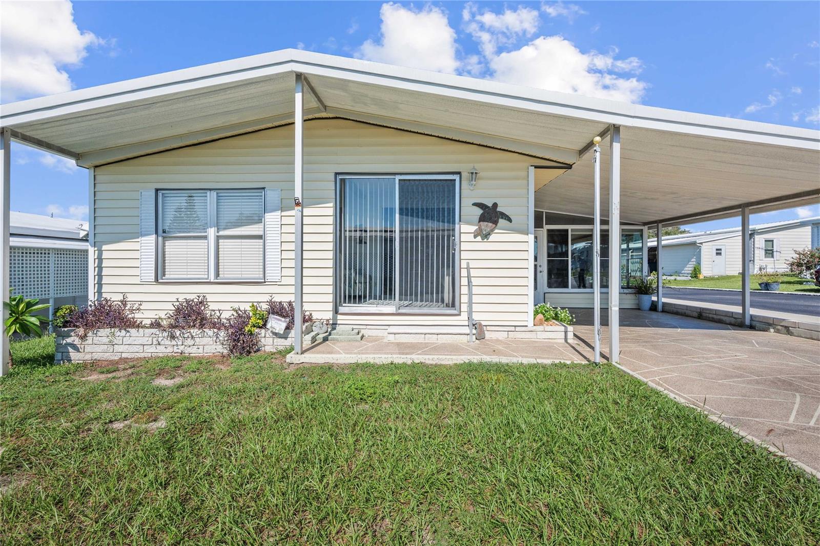 Charming Home in Spanish Trails Village – 55+ Community. Welcome to Spanish Trails Village, one of Zephyrhills’ most desirable active 55+ communities! This well-maintained 2-bedroom, 2-bath home is perfectly situated on a corner lot with an extra paved parking pad behind the home. Inside, you’ll find a bright, open layout designed for easy living and entertaining. The updated kitchen features beautiful new wood cabinets, countertops, and backsplash, and flows seamlessly into the dining and living areas. The dining space offers matching built-in cabinets for extra storage, while the spacious living room connects to a cozy family room with a large sliding door for natural light. This home is being sold fully furnished and turnkey, making it an ideal Florida winter retreat or comfortable full-time residence. A heated and cooled Florida room with walls of windows expands the living space and leads to the utility and laundry rooms. Additional highlights include a covered carport, a new roof (2023), and a 2015 HVAC system. Residents of Spanish Trails enjoy a vibrant lifestyle with access to a clubhouse, pool, and shuffleboard courts. The community’s prime location puts you just minutes from grocery stores, restaurants, medical facilities, golf courses, and entertainment such as bowling, movies, and shopping.
Don’t miss your chance to own a piece of Florida paradise—schedule your private showing today!