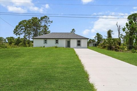 Photo of 460 Columbus Boulevard S, Lehigh Acres, FL 33974 (MLS # A4660060)