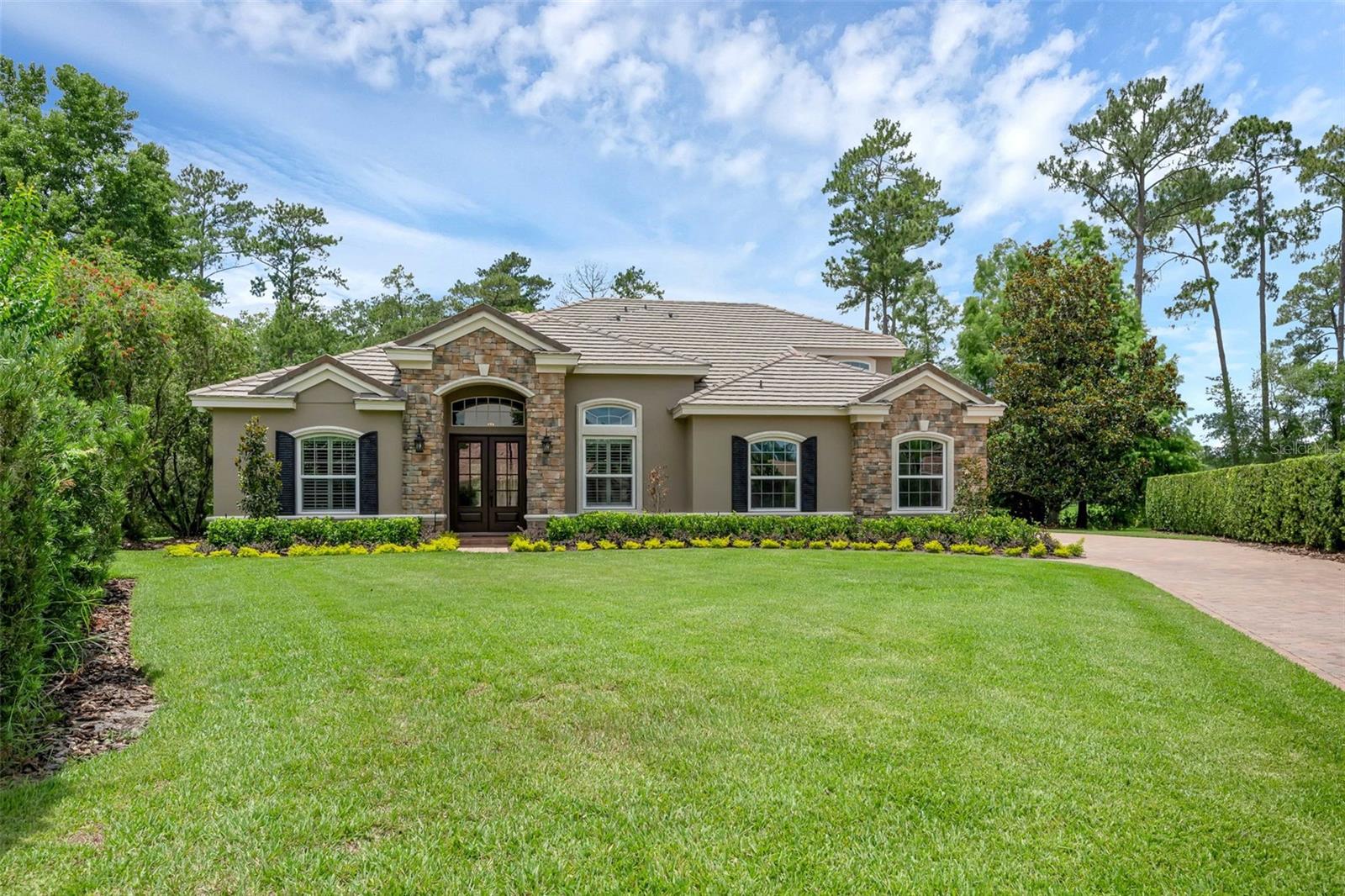 Discover a rare opportunity to own a beautifully upgraded estate home in one of Lake Mary’s most exclusive guard-gated communities—Magnolia Plantation. Tucked at the end of a quiet cul-de-sac on a generous half-acre lot, this home offers the ultimate in privacy and tranquility with an expansive wooded view and no rear neighbors—only the manicured grounds of the Mike Bender Golf Academy.
This 4-bedroom, 4-bath residence has been thoughtfully reimagined with major renovations and upscale enhancements, including:
Dual new HVAC systems (2022), Gorgeous pool resurfacing (2022), Complete bathroom renovations (2022), Designer kitchen transformation (2025), Updated doors, plantation shutters, and new window installations, Custom library built-ins and chic new landscaping, A fully upgraded irrigation system and pool equipment.
Inside, you’ll find a layout that lives large yet feels intimate. The light-filled primary suite features two walk-in closets, a peaceful sitting area with views of the pool and wooded preserve, and a spa-style bath that evokes a luxury retreat. Each secondary bedroom enjoys either an en-suite or direct bathroom access, and the spacious upstairs suite—with its private full bath—is ideal for guests, a teen suite, or multi-generational living.
The heart of the home opens to a screened-in lanai and sparkling pool, offering seamless indoor-outdoor living, whether you're hosting or simply enjoying a quiet evening.
Magnolia Plantation is more than just a neighborhood—it’s a lifestyle, with top-rated Seminole County schools, close proximity to Lake Mary’s dining and retail scene, and quick access to I-4, 417, and 429.
If you’re searching for modern luxury, ultimate privacy, and a prime location, this home delivers it all—with elegance to match.