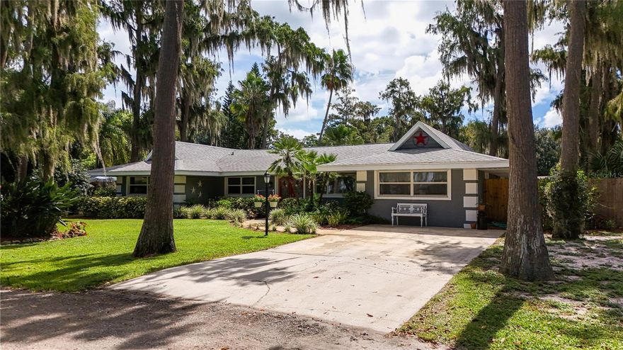 Welcome to your Florida lakeside sanctuary. This beautifully updated canal-front pool home provides direct access to the stunning Clermont Chain of Lakes, making it the ultimate private retreat for water-loving residents. Featuring a pristine 3-bedroom, 2-bath layout with two flexible bonus rooms, this home masterfully combines modern luxury with relaxed outdoor living.
Recent 2021 upgrades showcase the care put into this property, from the new roof and updated plumbing to the stunningly remodeled kitchen. Enjoy seamless indoor-outdoor living with new glass sliding doors leading to a spacious, fenced pool area. The outdoor space is a true paradise, complete with a sparkling pool, a lush garden, and a fire pit for unforgettable gatherings. For the boating and watersport enthusiast, the expansive dock provides direct canal access to Lake Minnehaha, complemented by extra parking for your trailer and a 10x16 double-lofted barn, with utilities for storing all your gear. This turn-key property is waiting for you to start living the dream.